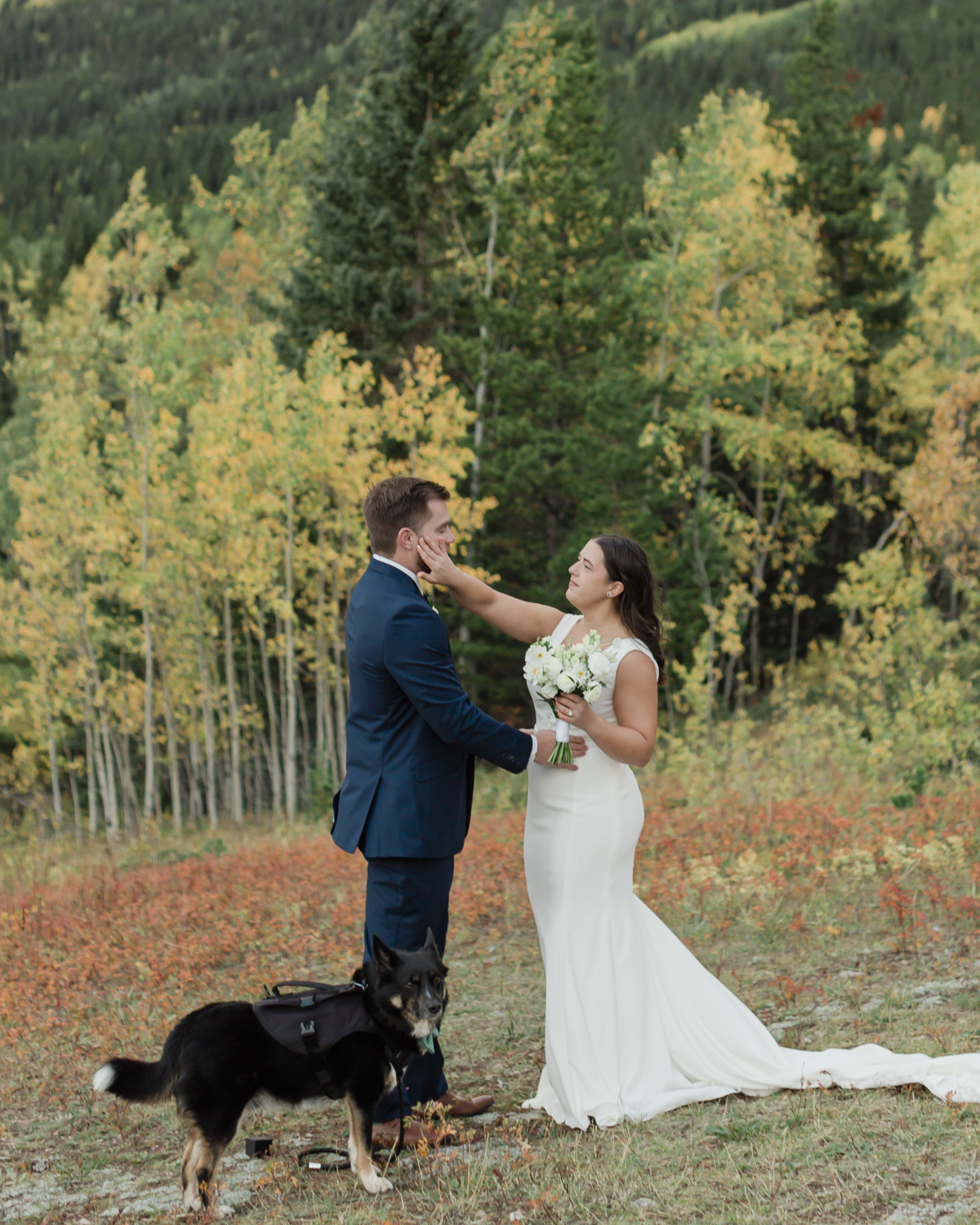 A couple exchanging vows and rings during their Kananaskis Country ceremony