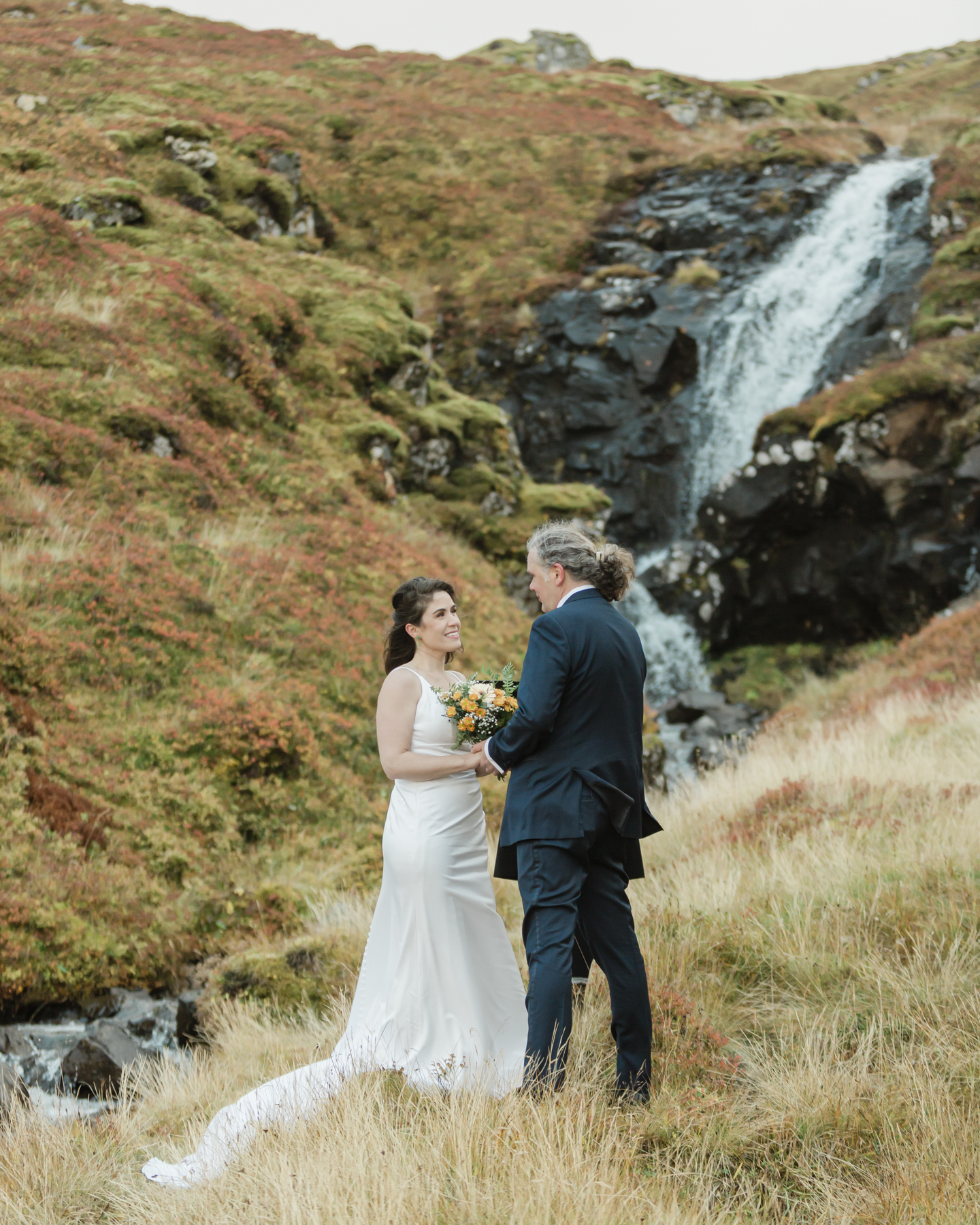 A couple eloping near a secluded waterfall in Iceland