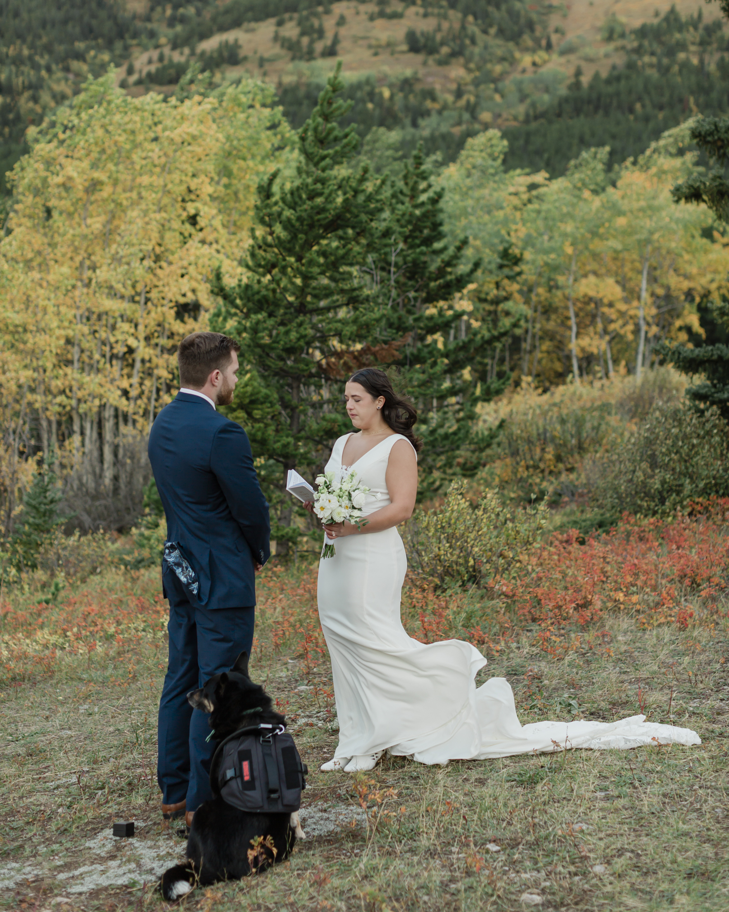 A couple exchanging vows and rings during their Kananaskis Country ceremony