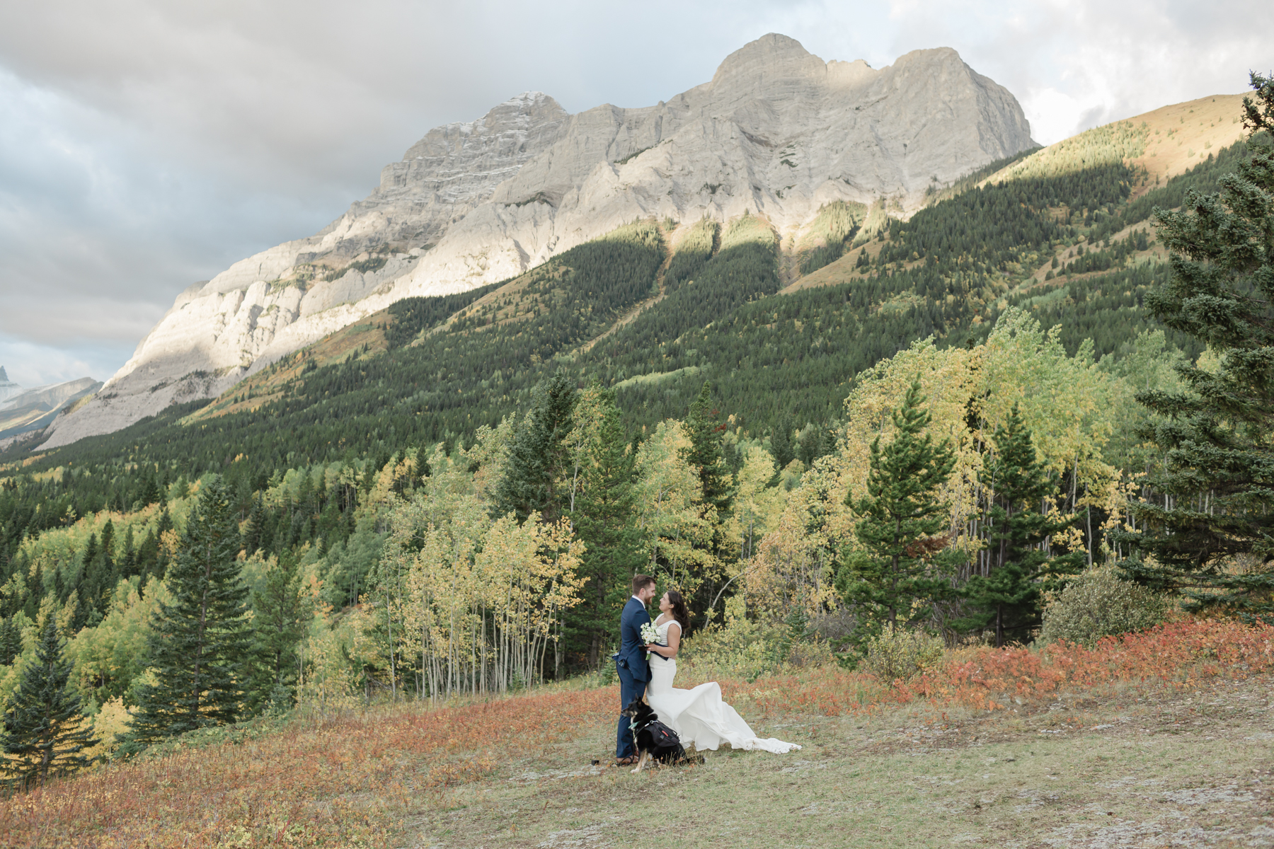 A couple exchanging vows and rings during their Kananaskis Country ceremony