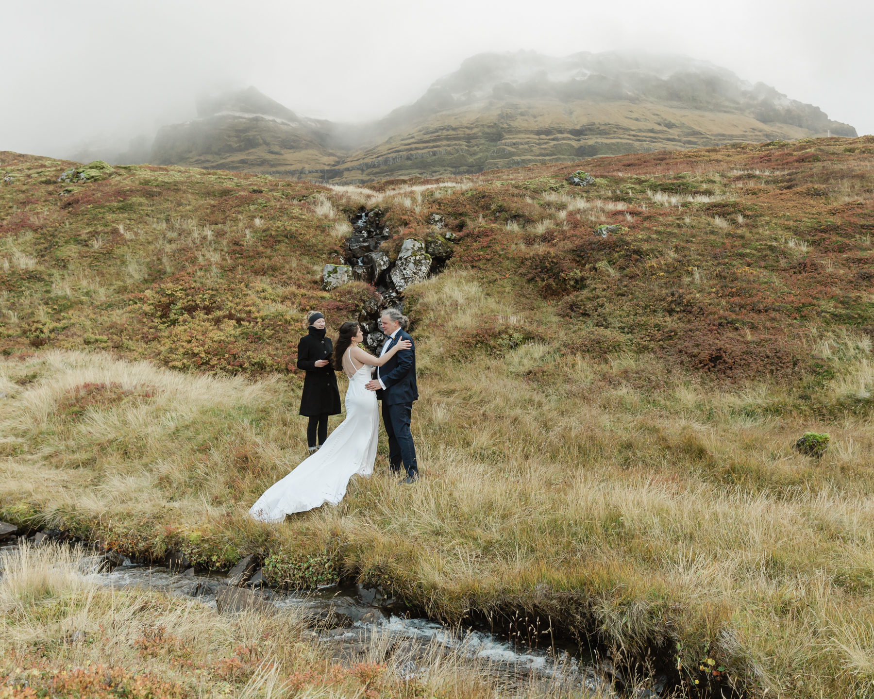 A couple eloping near a secluded waterfall in Iceland