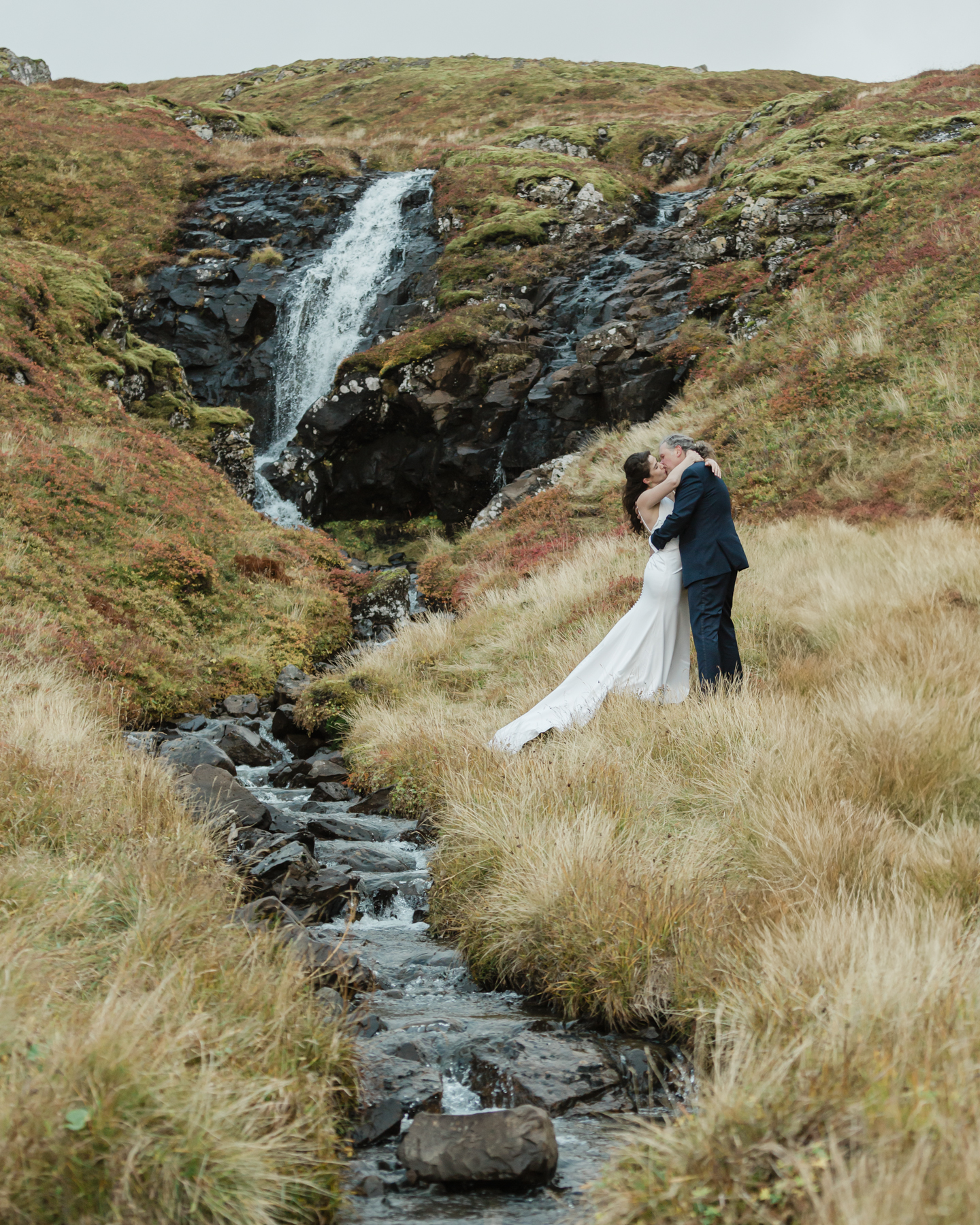 A couple eloping near a secluded waterfall in Iceland