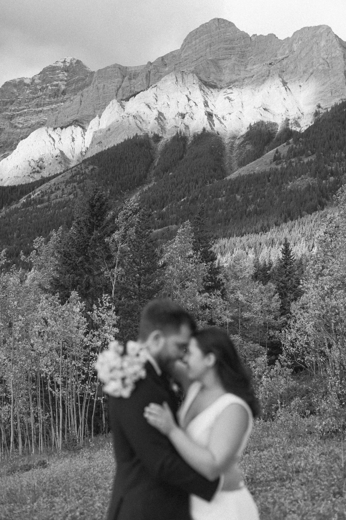 A couple smiling during their Kananaskis Country ceremony