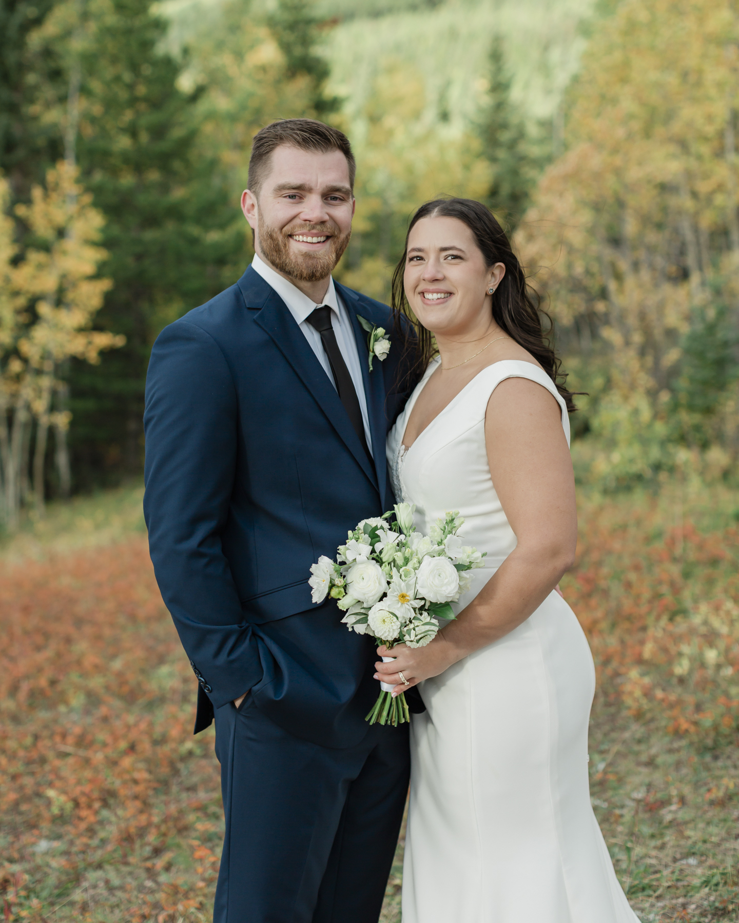 A couple walking during their Kananaskis Country ceremony