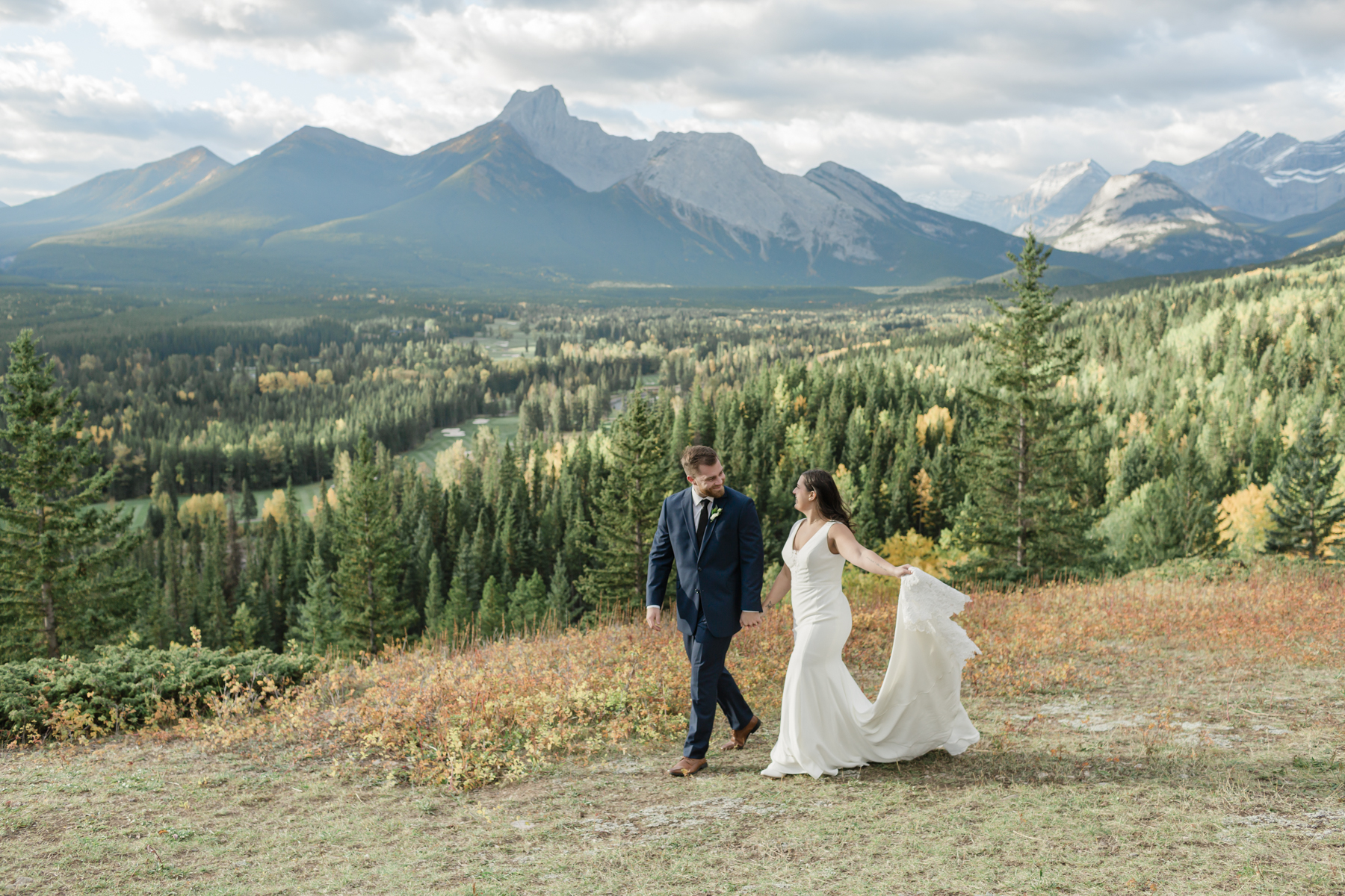 A couple walking during their Kananaskis Country ceremony