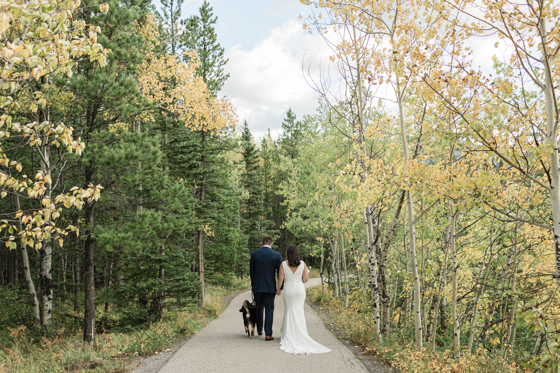 A couple walking during their elopement near Mount Kidd