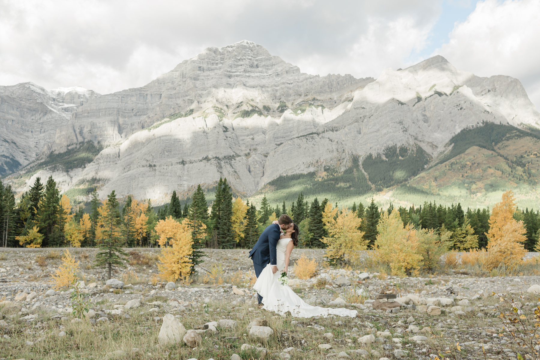 A couple kissing during their elopement near Mount Kidd