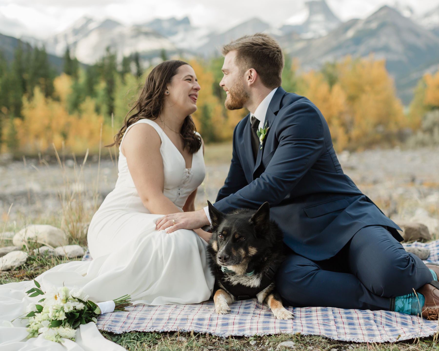 A couple celebrating with a picnic during their elopement near Mount Kidd