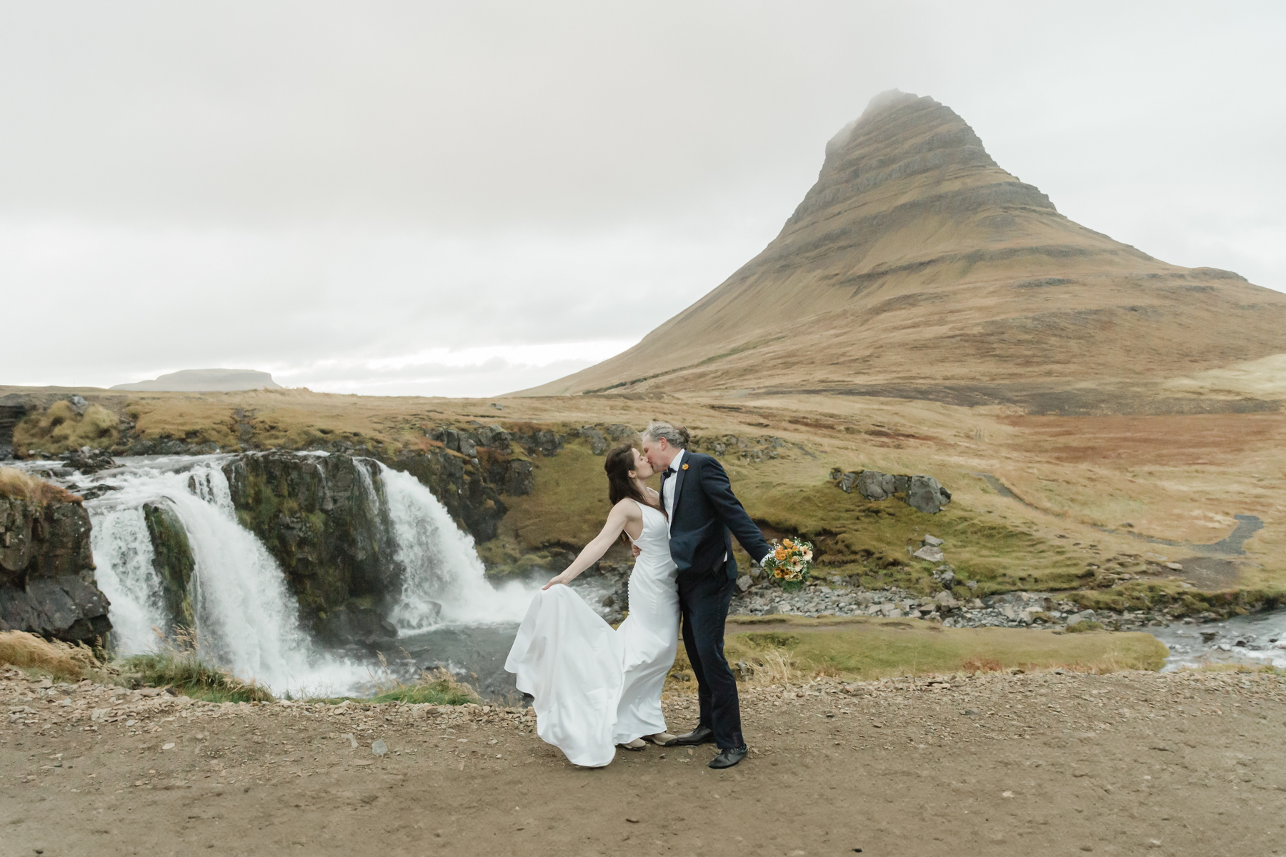 Kristen and Adam in front of Kirkjufell mountain in Iceland