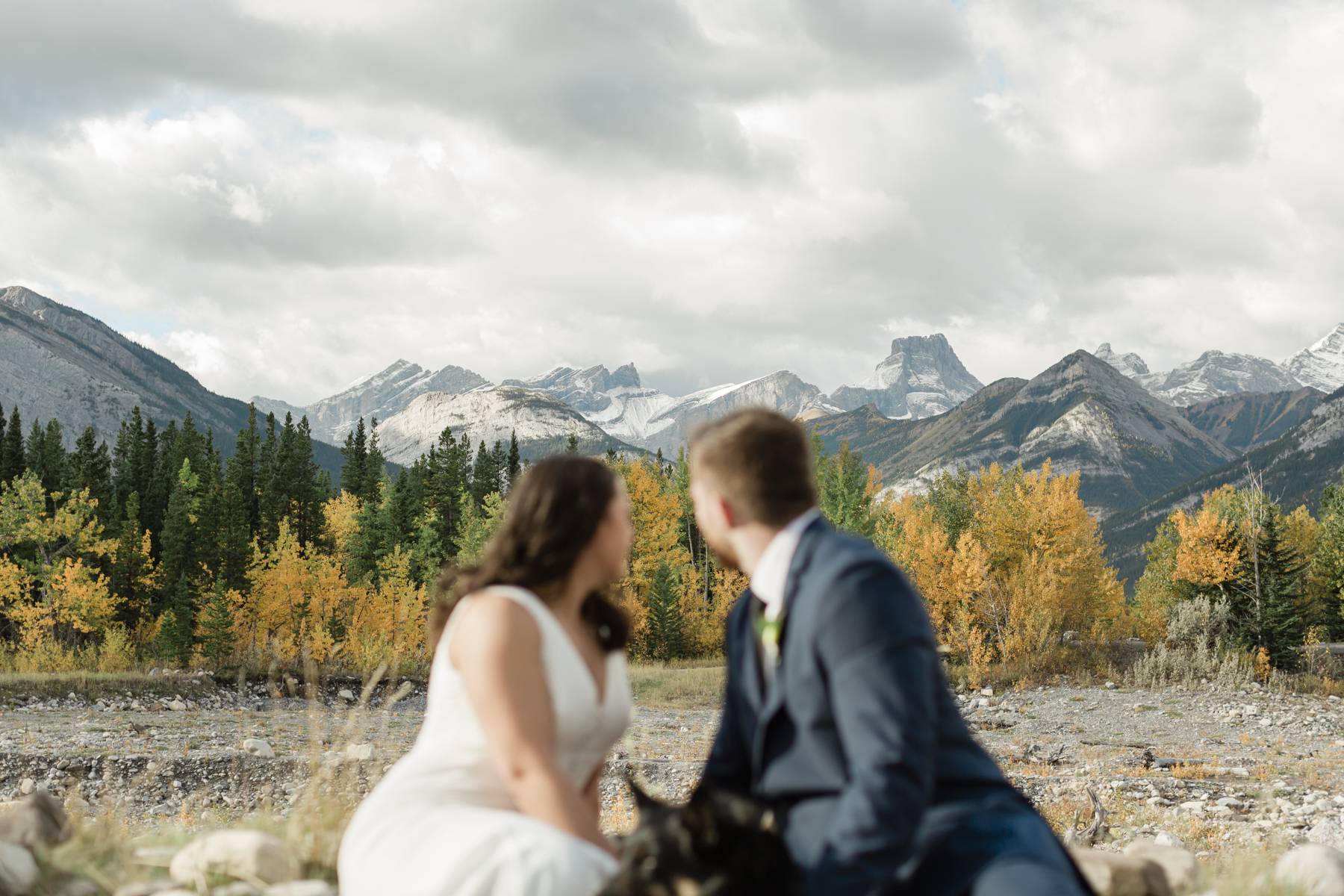 A couple celebrating with a picnic during their elopement near Mount Kidd