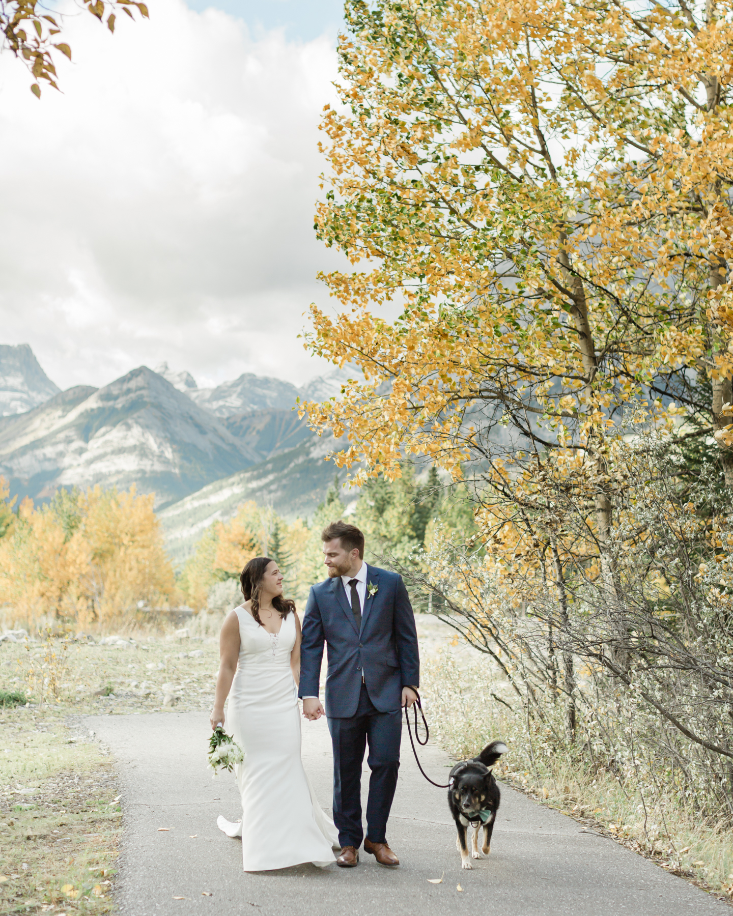 A couple walking during their elopement near Mount Kidd