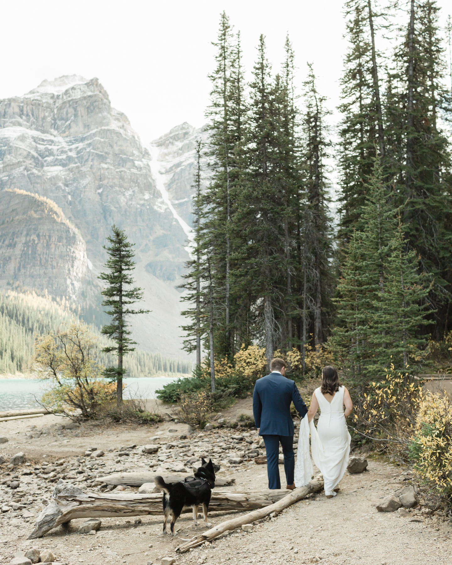 A couple walking around Moraine Lake during their elopement 