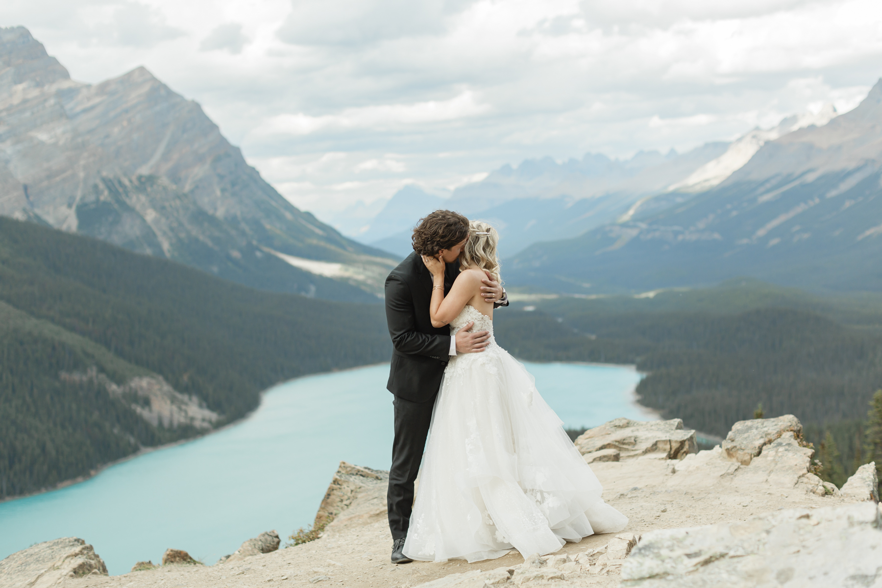 A couple embracing in front of the Canadian rockies