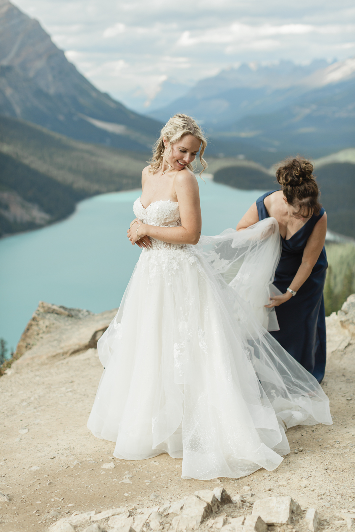 A couple looking at the mountains after they got married in Banff National Park at Peyto Lake