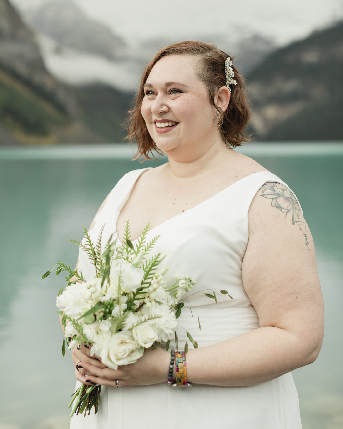 A portrait of a queer bride that just got married at Lake Louise