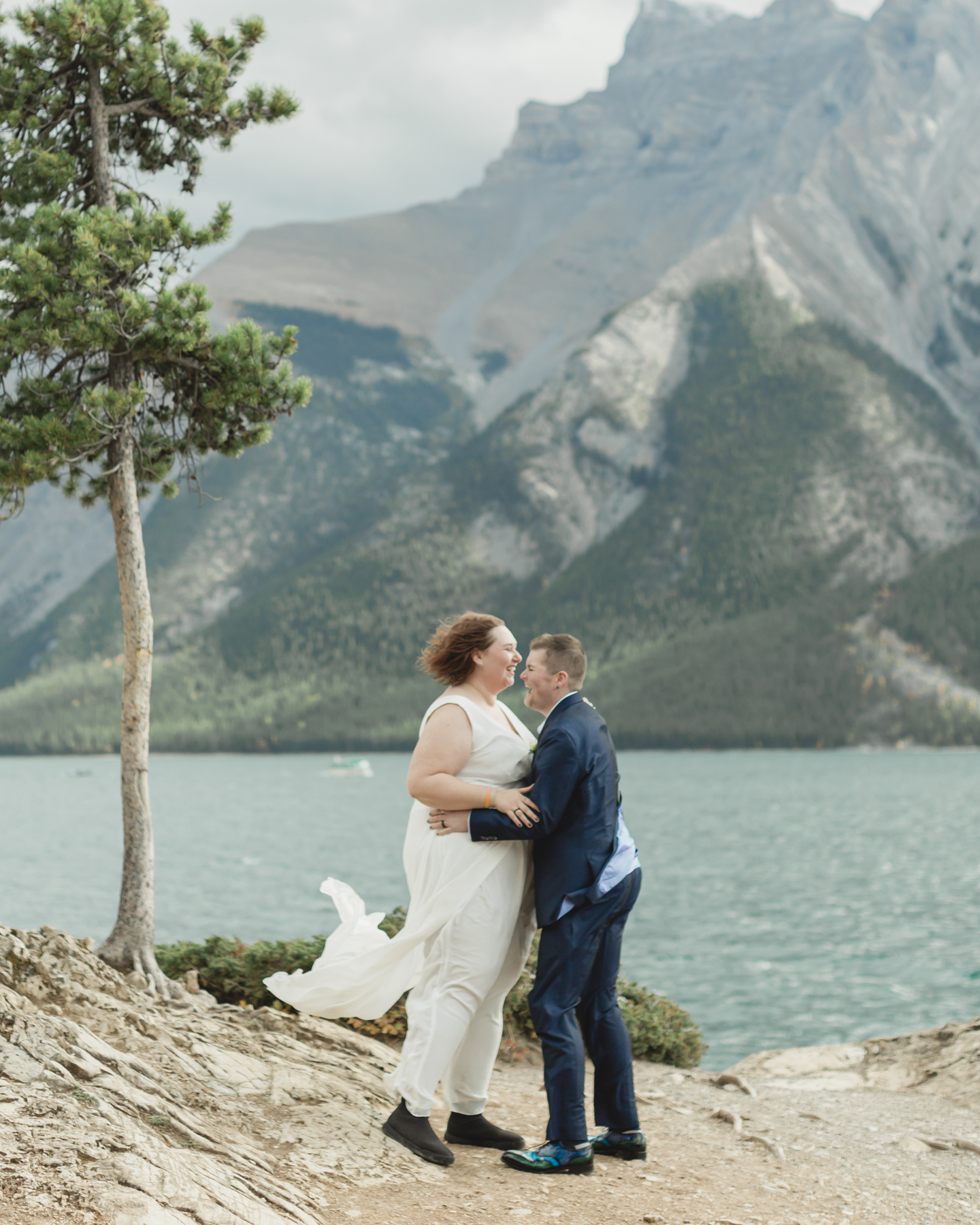 A LGBTQIA+ having their first dance after their elopement at Lake Minnewanka 