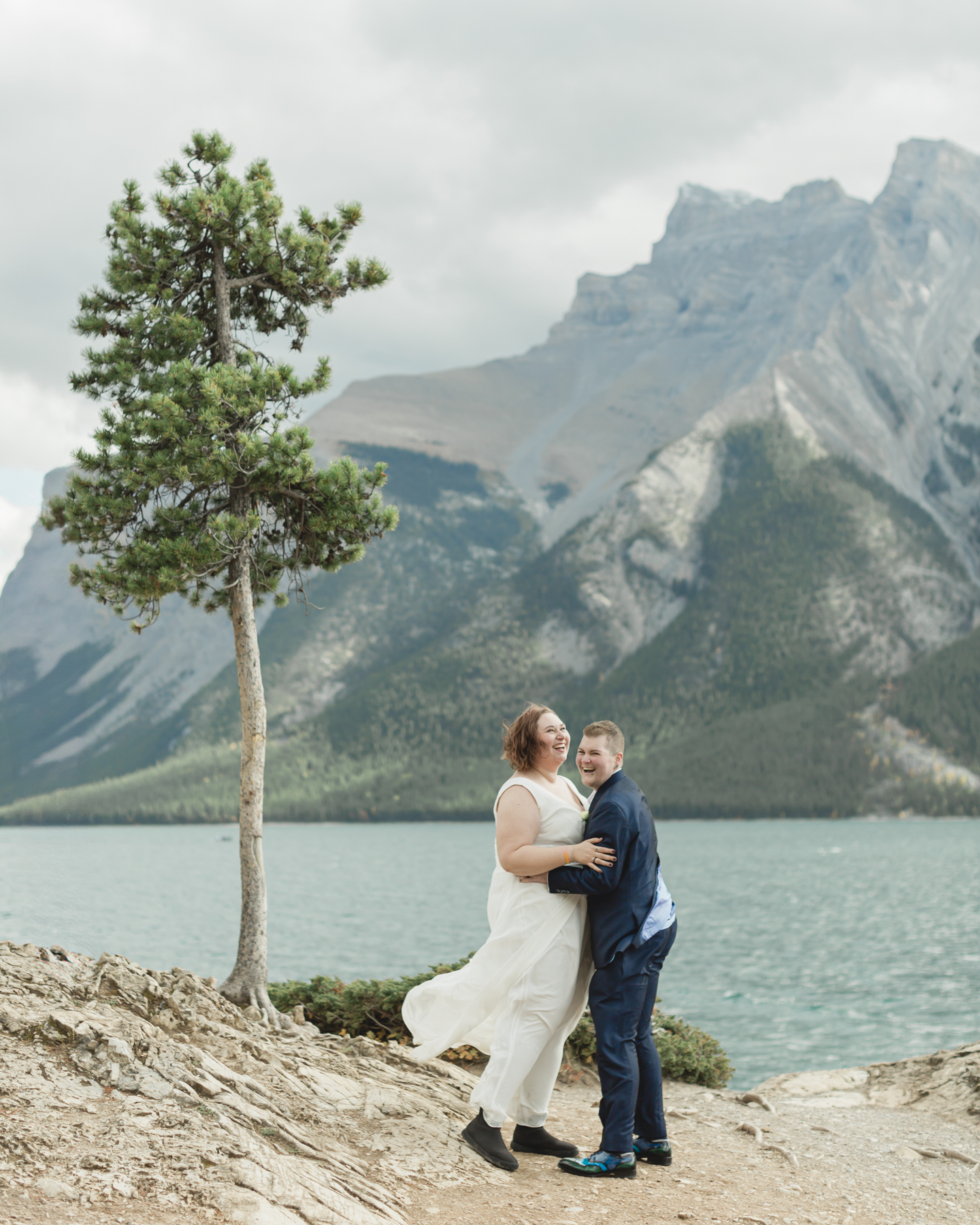 A LGBTQIA+ having their first dance after their elopement at Lake Minnewanka 