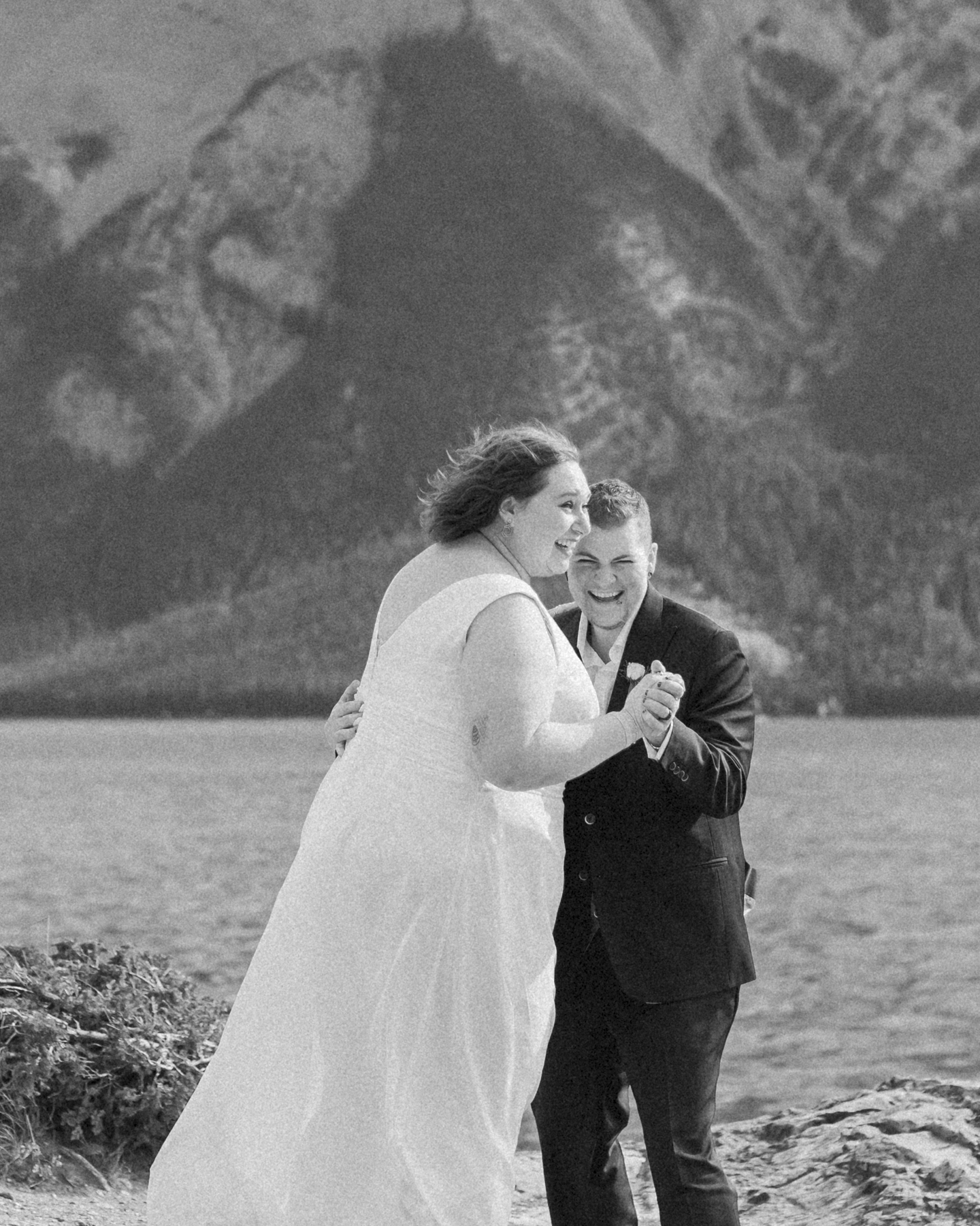 A LGBTQIA+ having their first dance after their elopement at Lake Minnewanka 