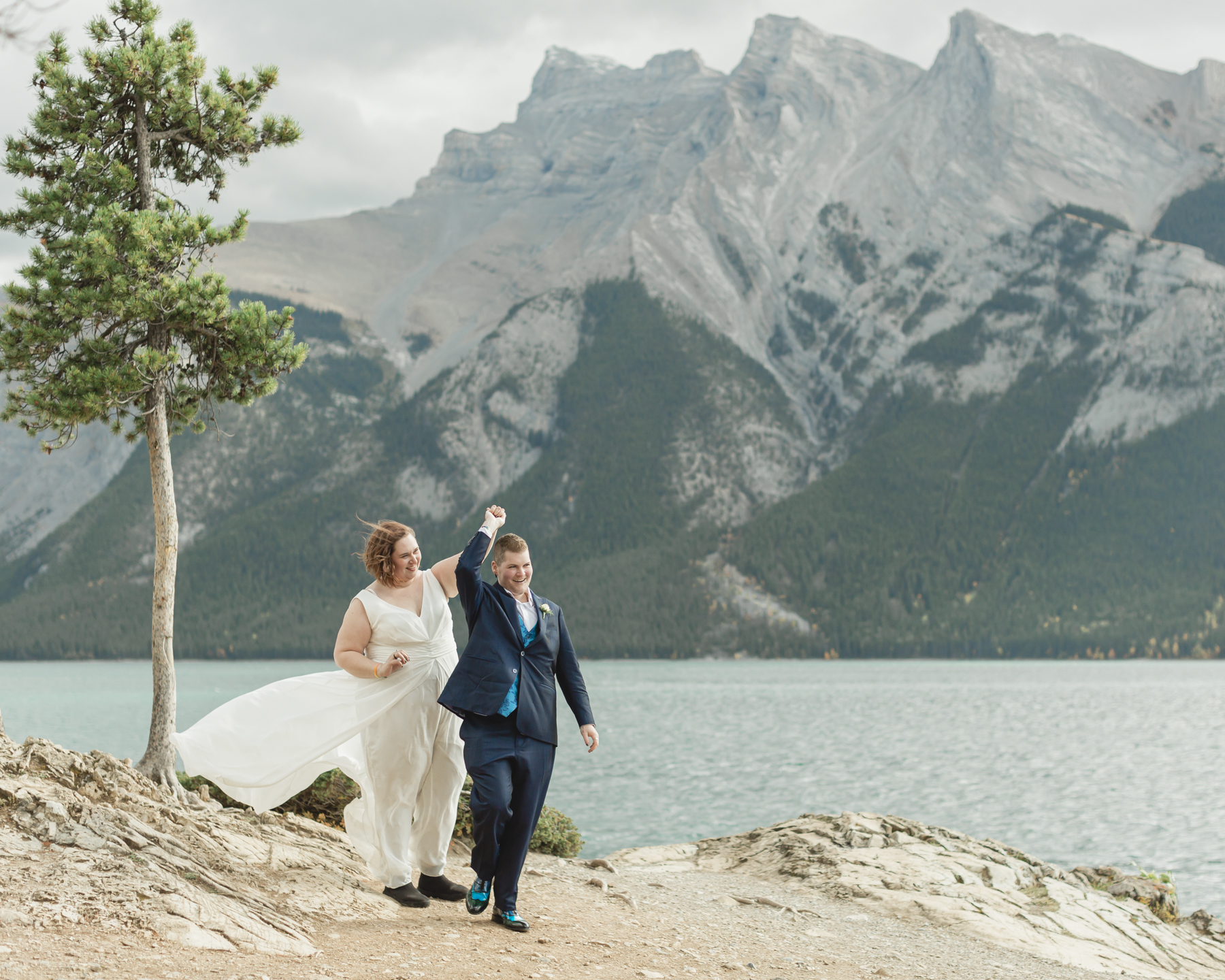 A LGBTQIA+ having their first dance after their elopement at Lake Minnewanka 