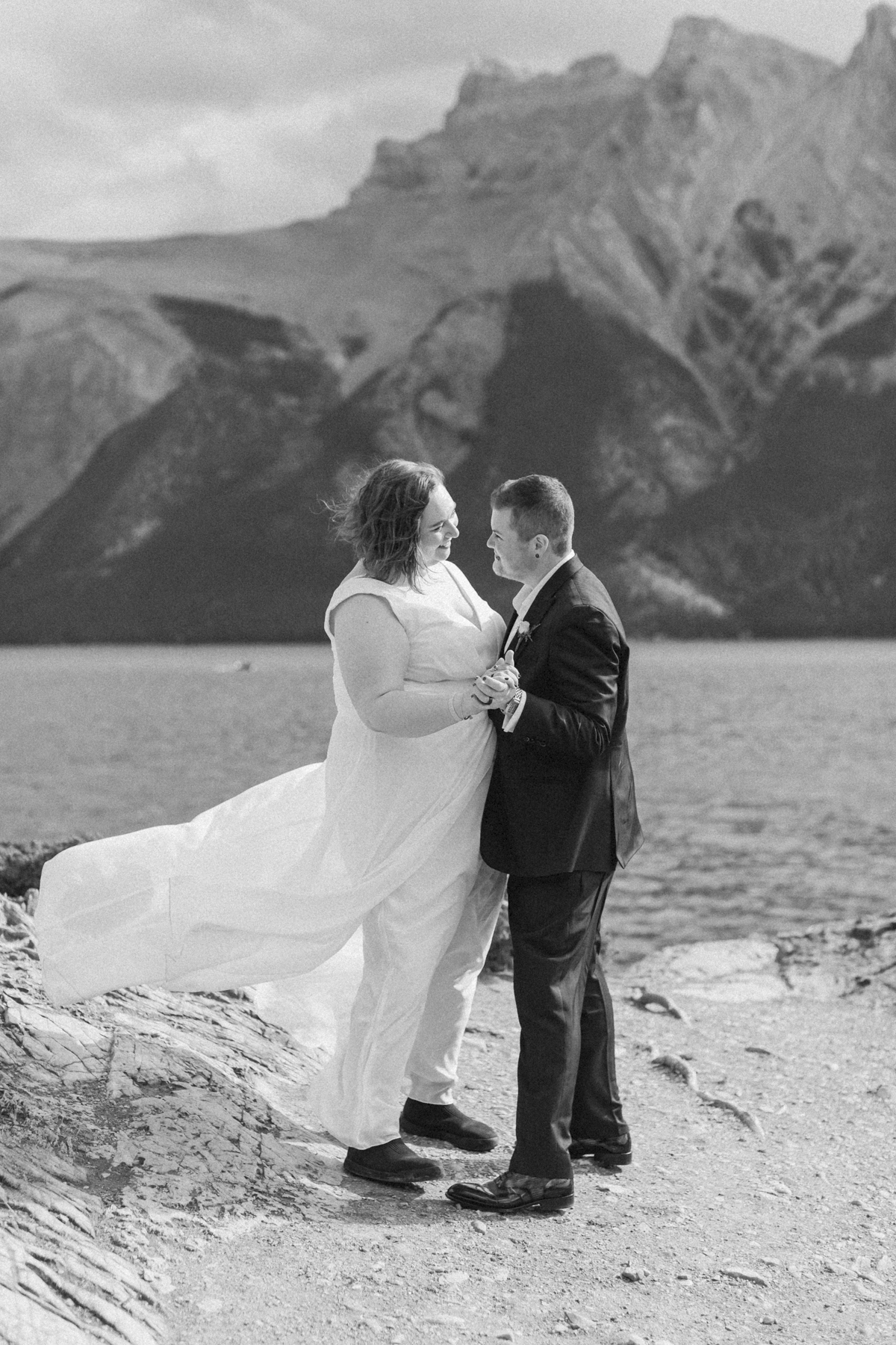 A LGBTQIA+ having their first dance after their elopement at Lake Minnewanka 