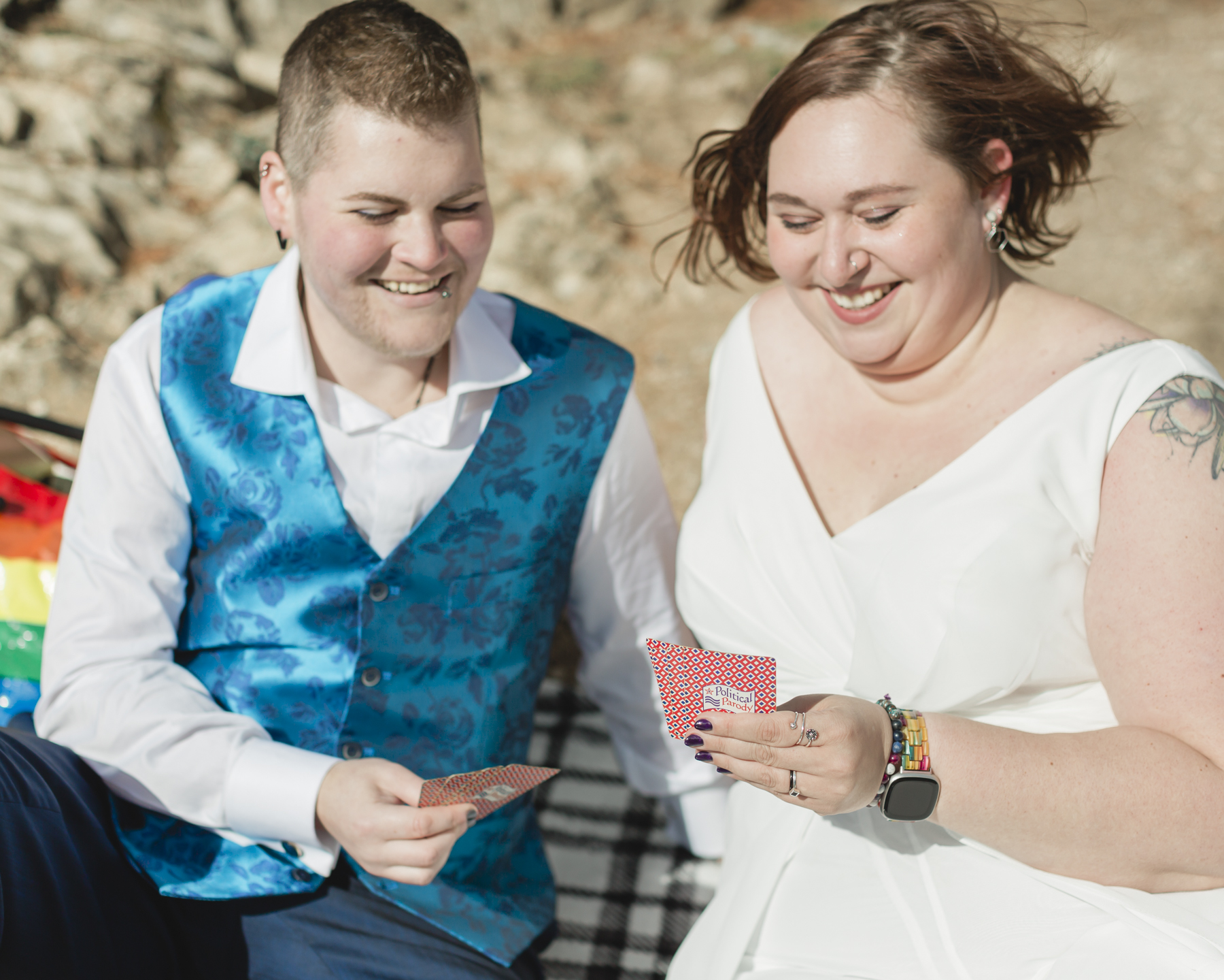 A LGBTQIA+ enjoying a picnic together after their elopement at Lake Minnewanka 