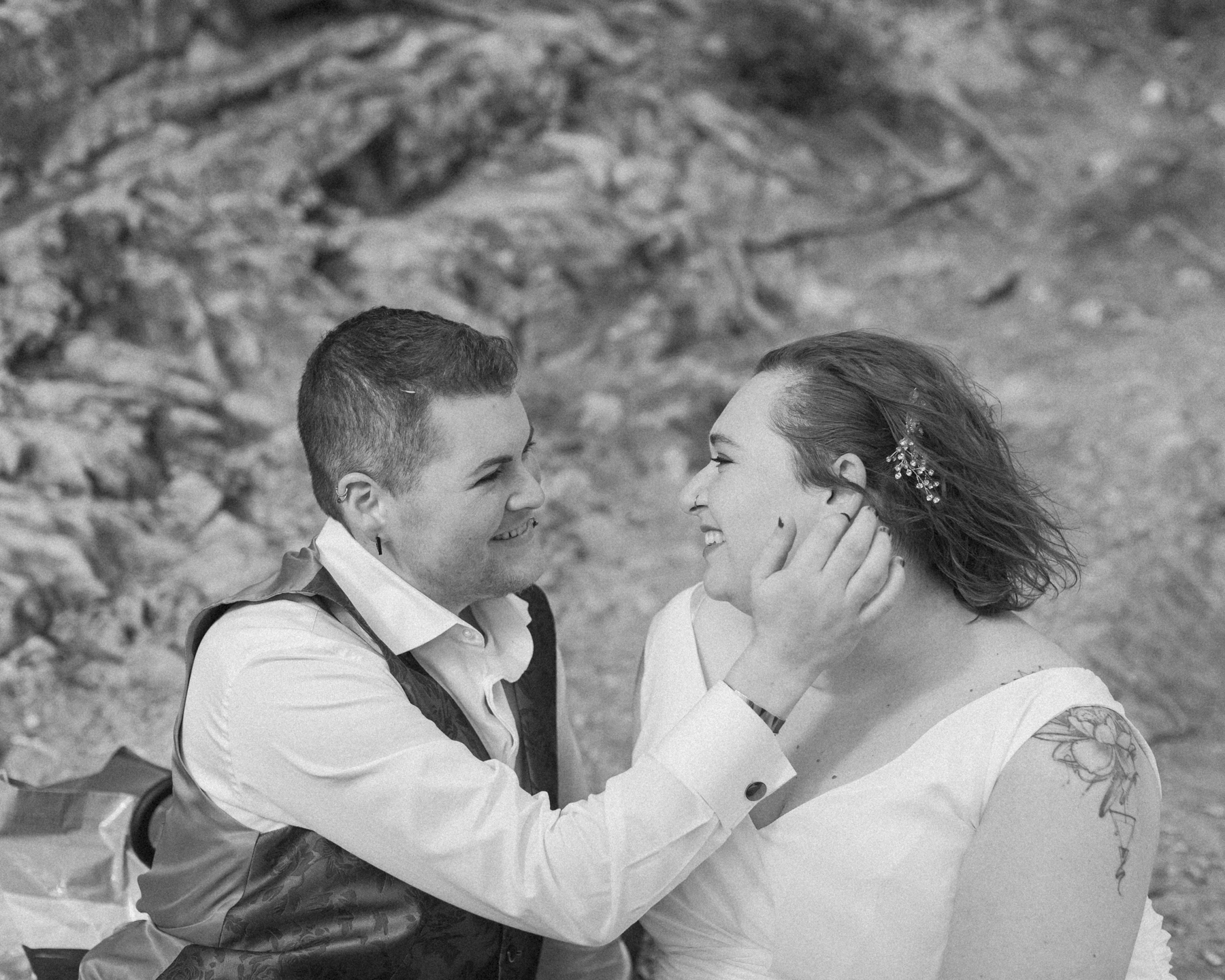 A LGBTQIA+ enjoying a picnic together after their elopement at Lake Minnewanka 