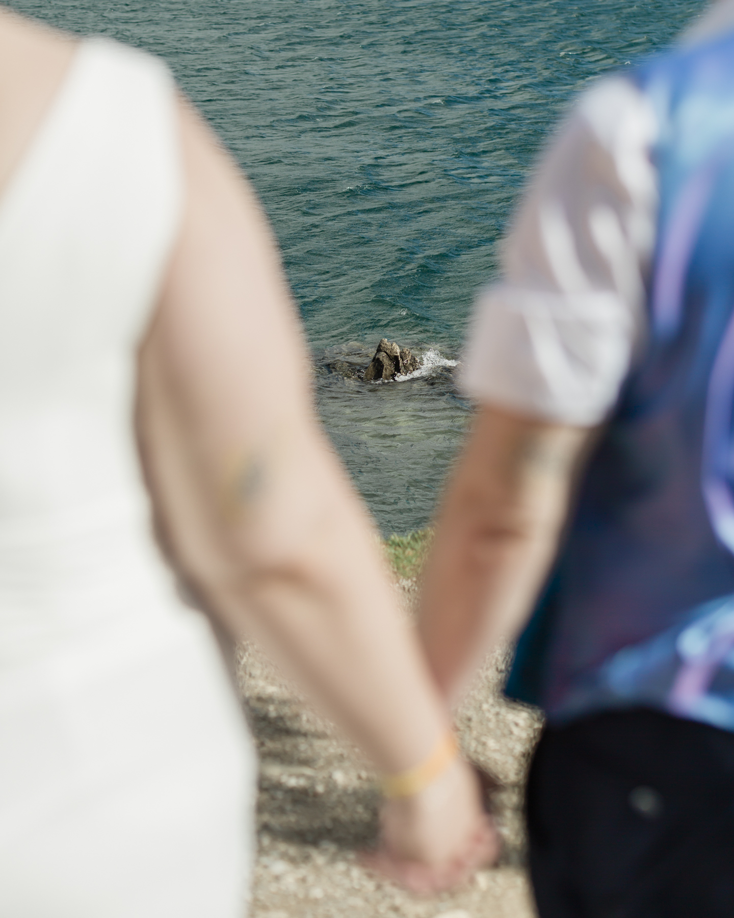 A LGBTQIA+ enjoying a picnic together after their elopement at Lake Minnewanka 