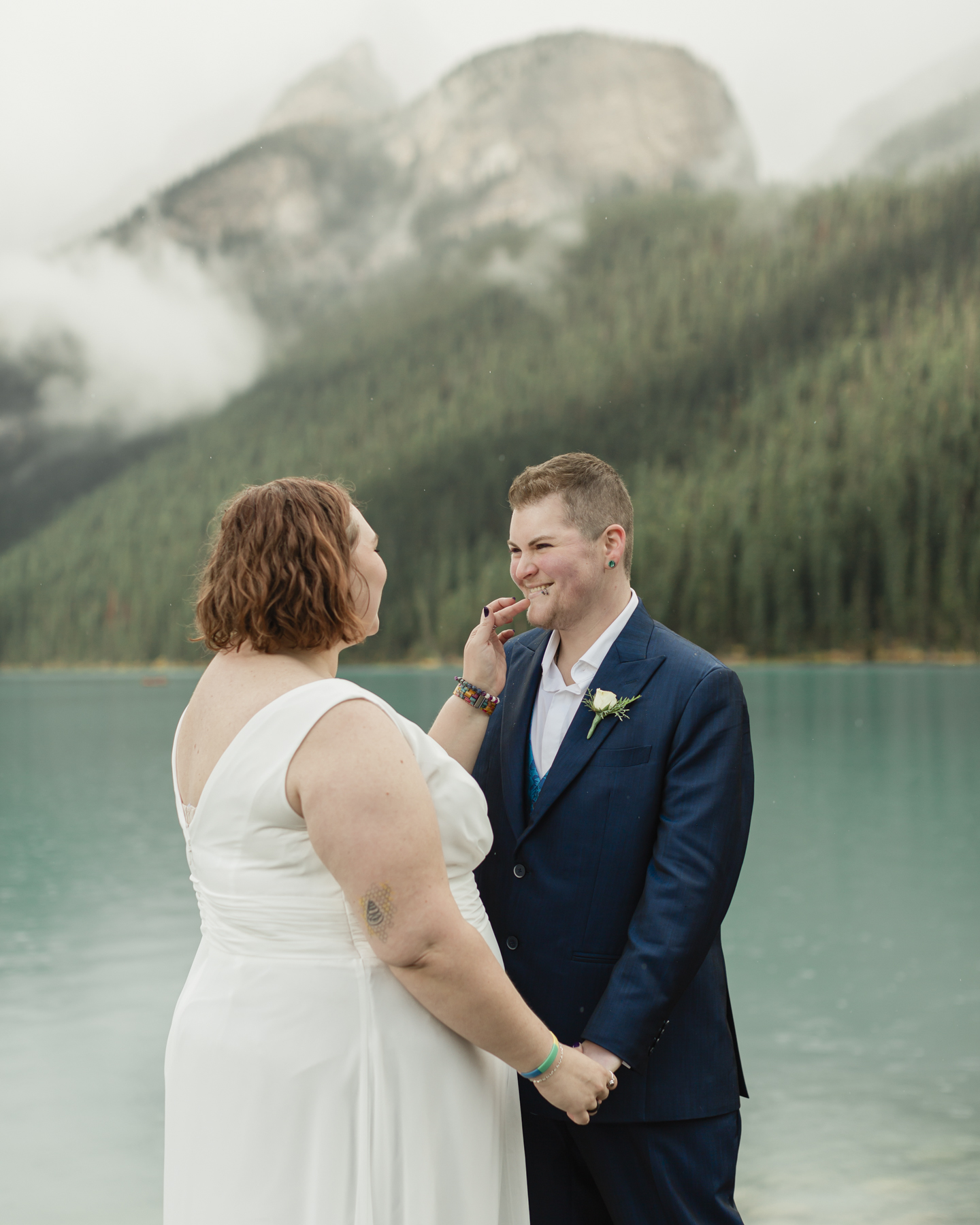 A queer couple that is getting married  at Lake Louise in Banff 