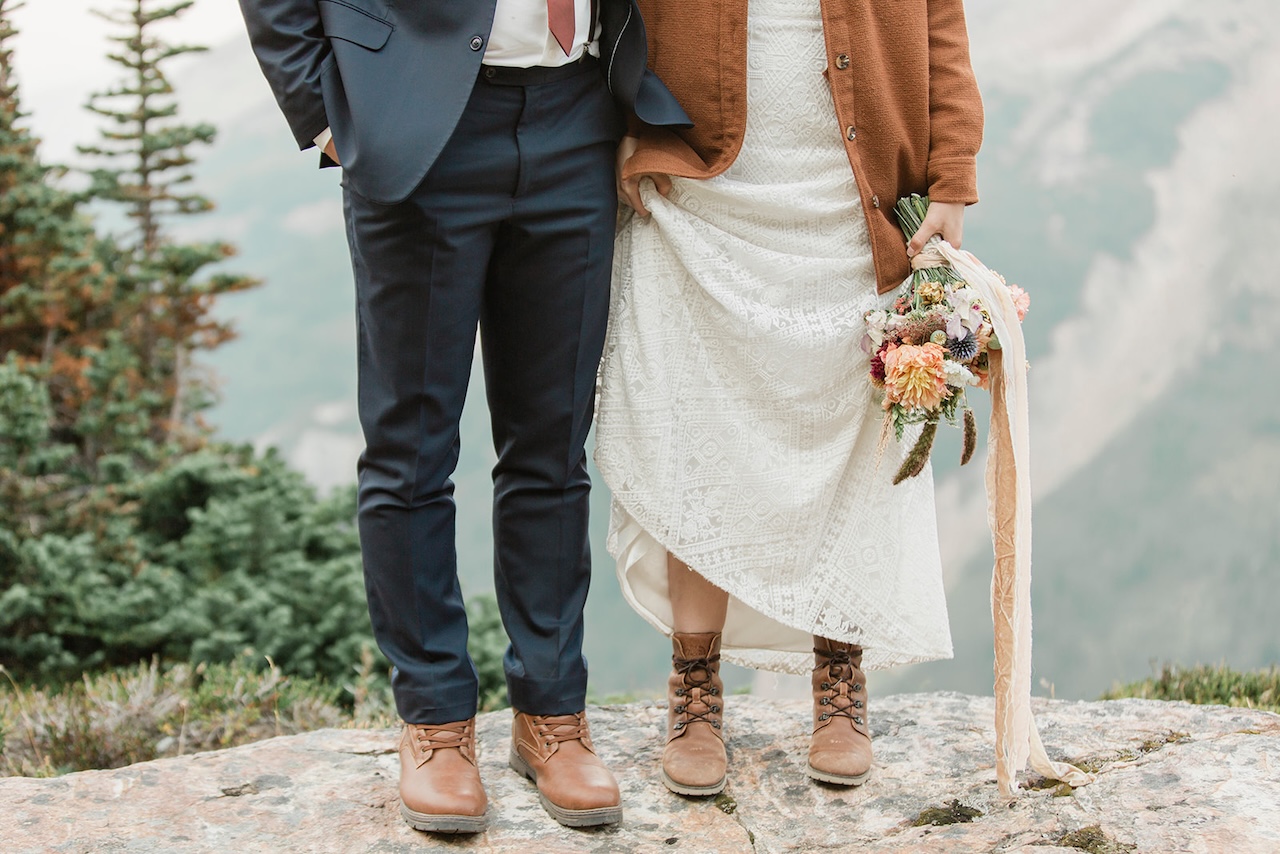 Emily & Jon show us their hiking boots on their adventure elopement