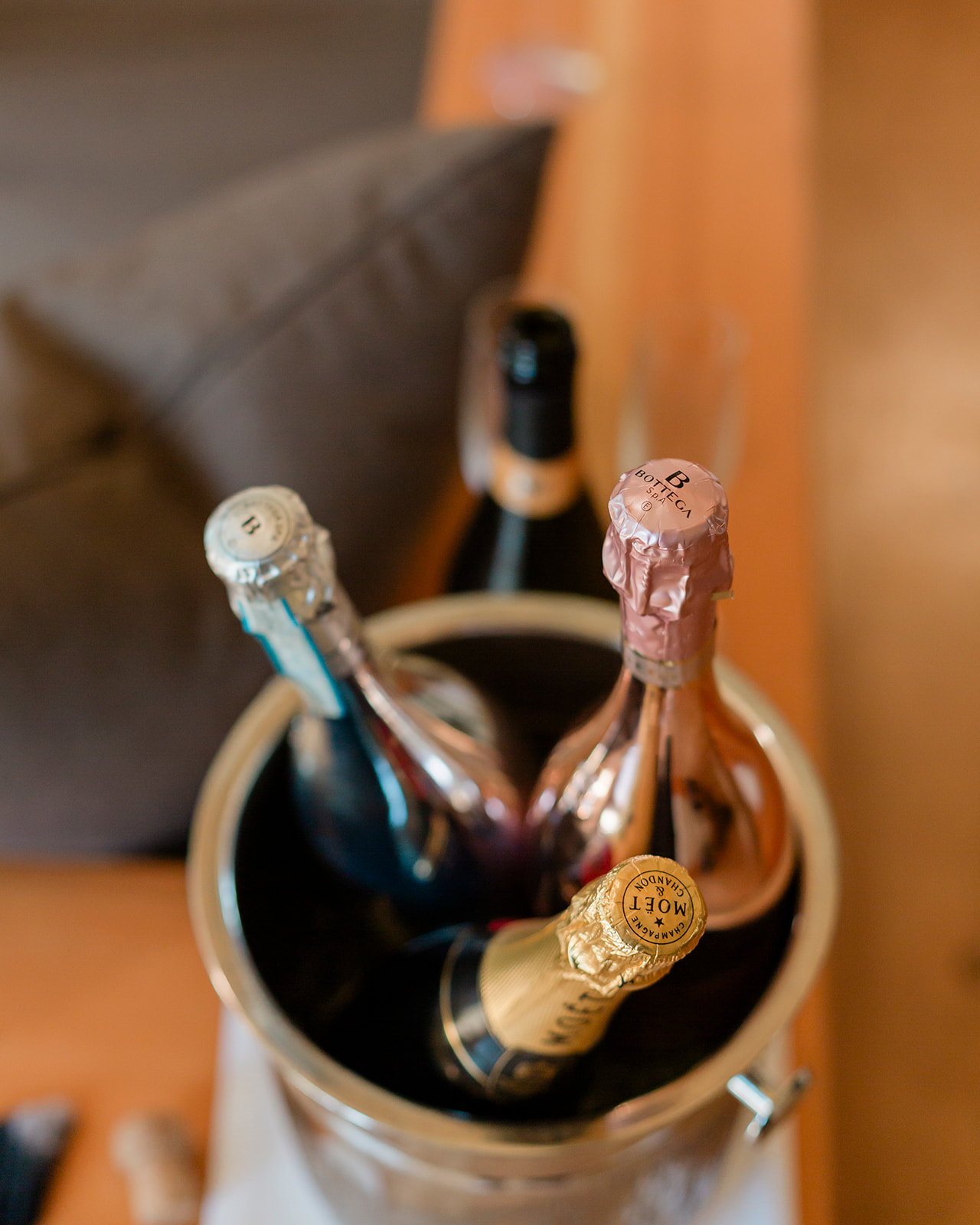 champagne bottles chilling in a bucket for a moraine lake elopement
