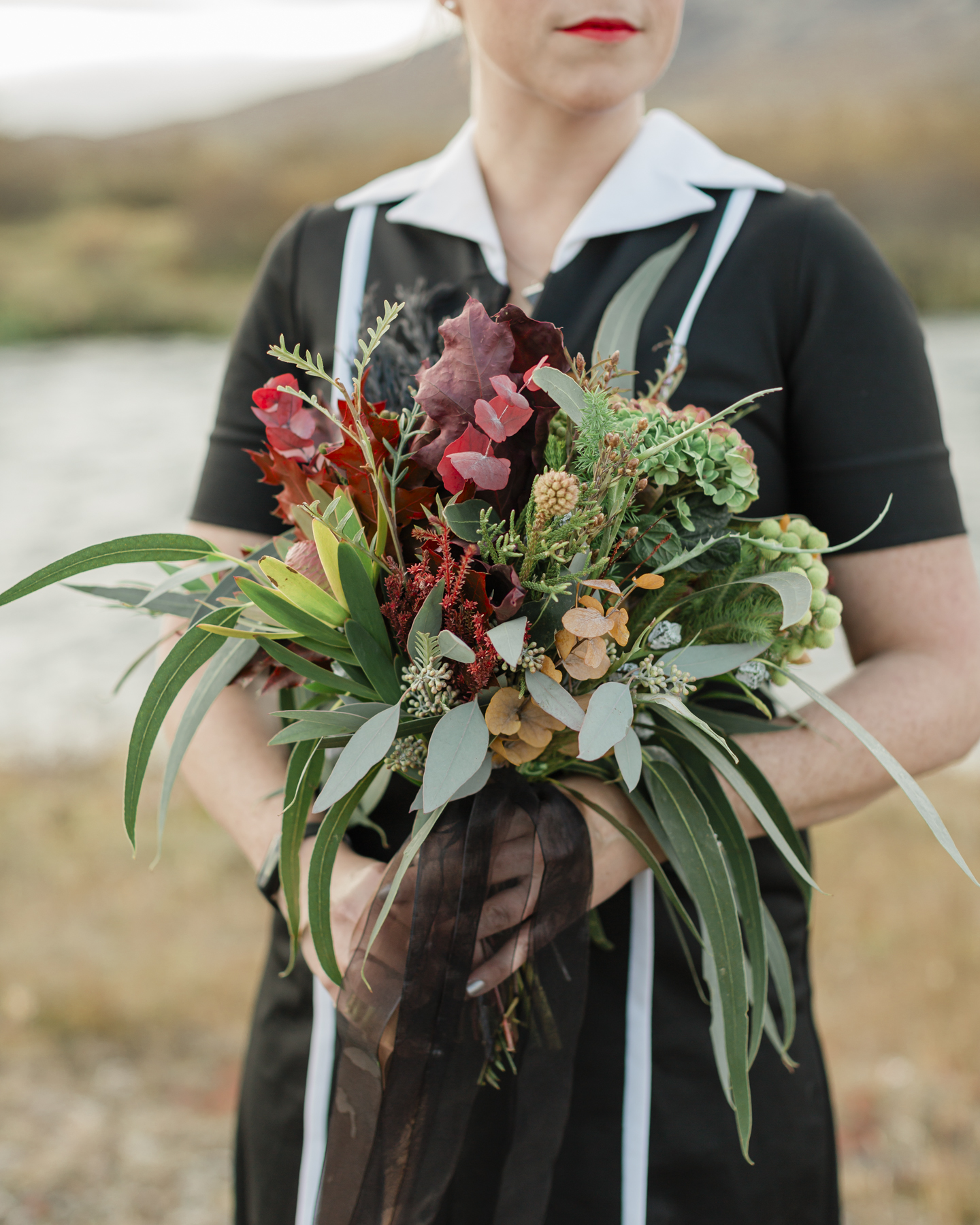 Bridal portraits showcasing her accessories and wedding bouquet for her Iceland elopement 