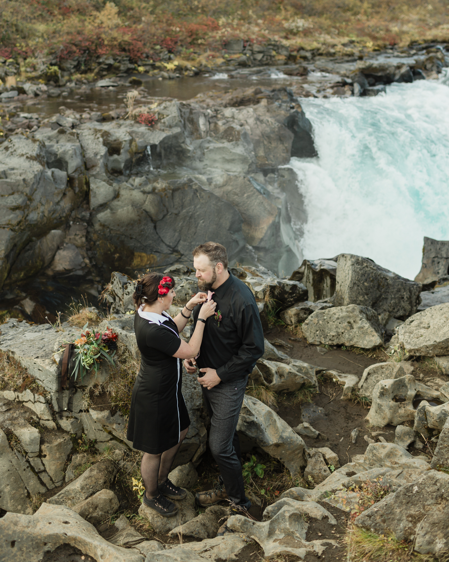 Virginia and Derek are about to have their elopement ceremony in front of a running waterfall in Iceland on the Golden Circle