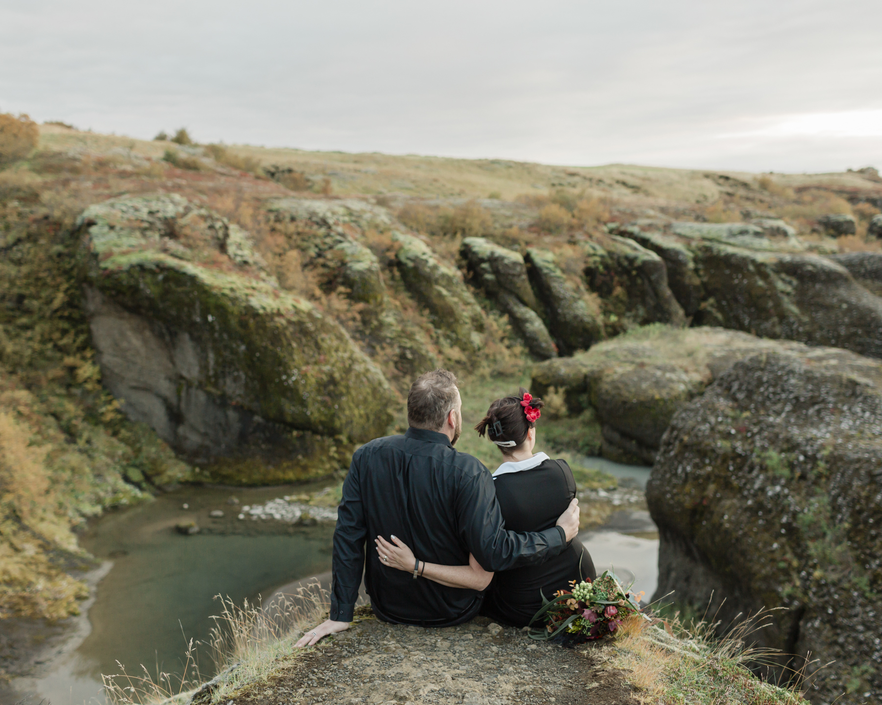 Virginia and Derek looking out into an Iceland canyon and enjoying the view after their elopement ceremony 