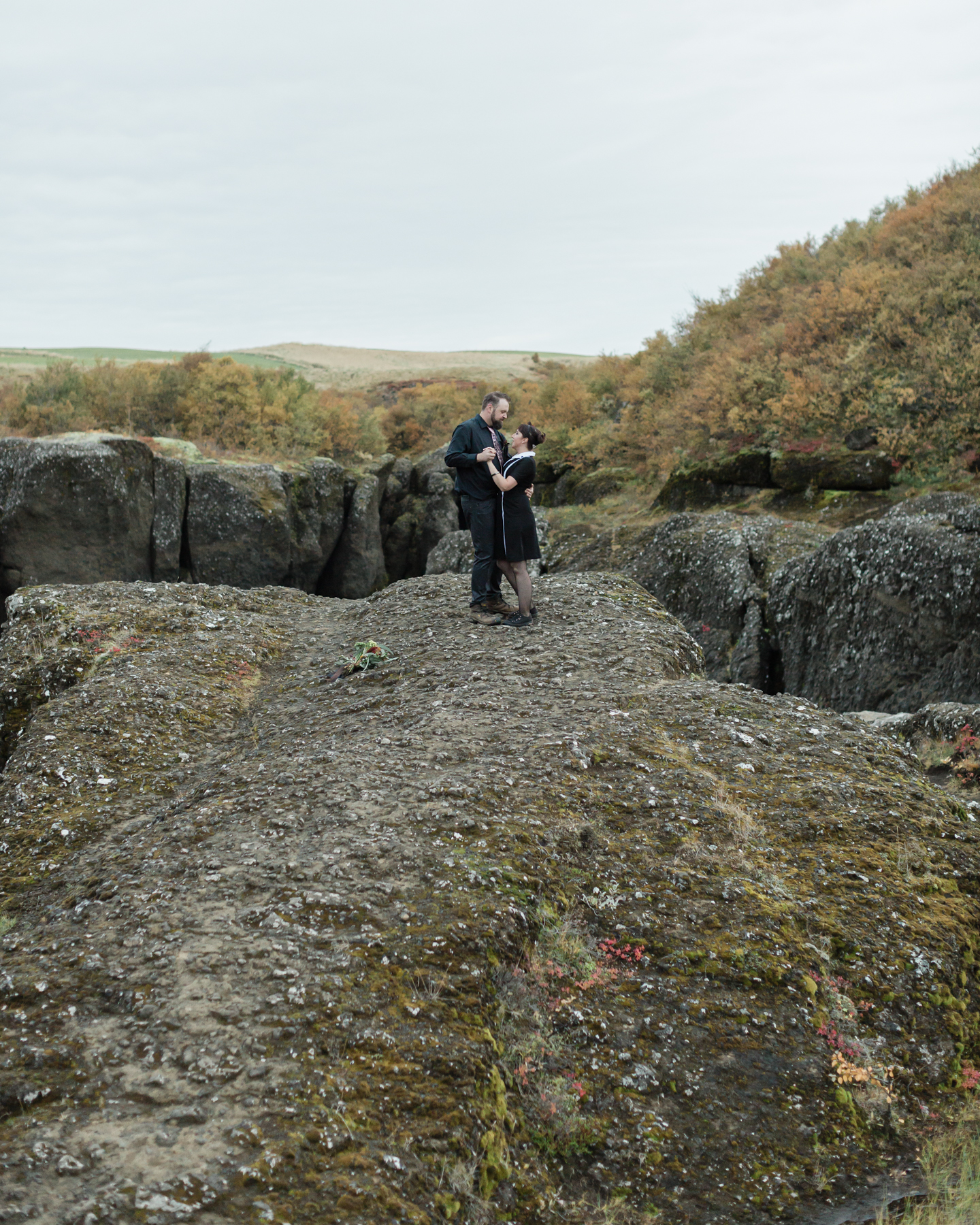 Virginia and Derek having their first dance in an Iceland canyon after their elopement ceremony