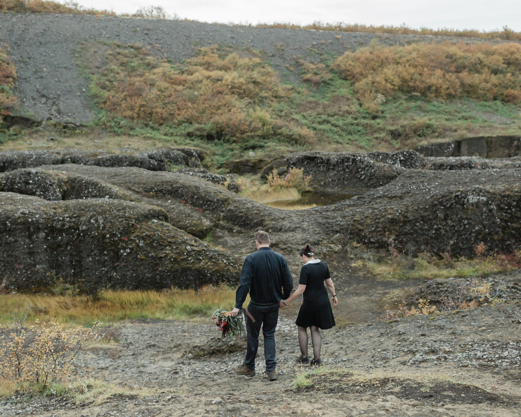 Virginia and Derek having their first dance in an Iceland canyon after their elopement ceremony