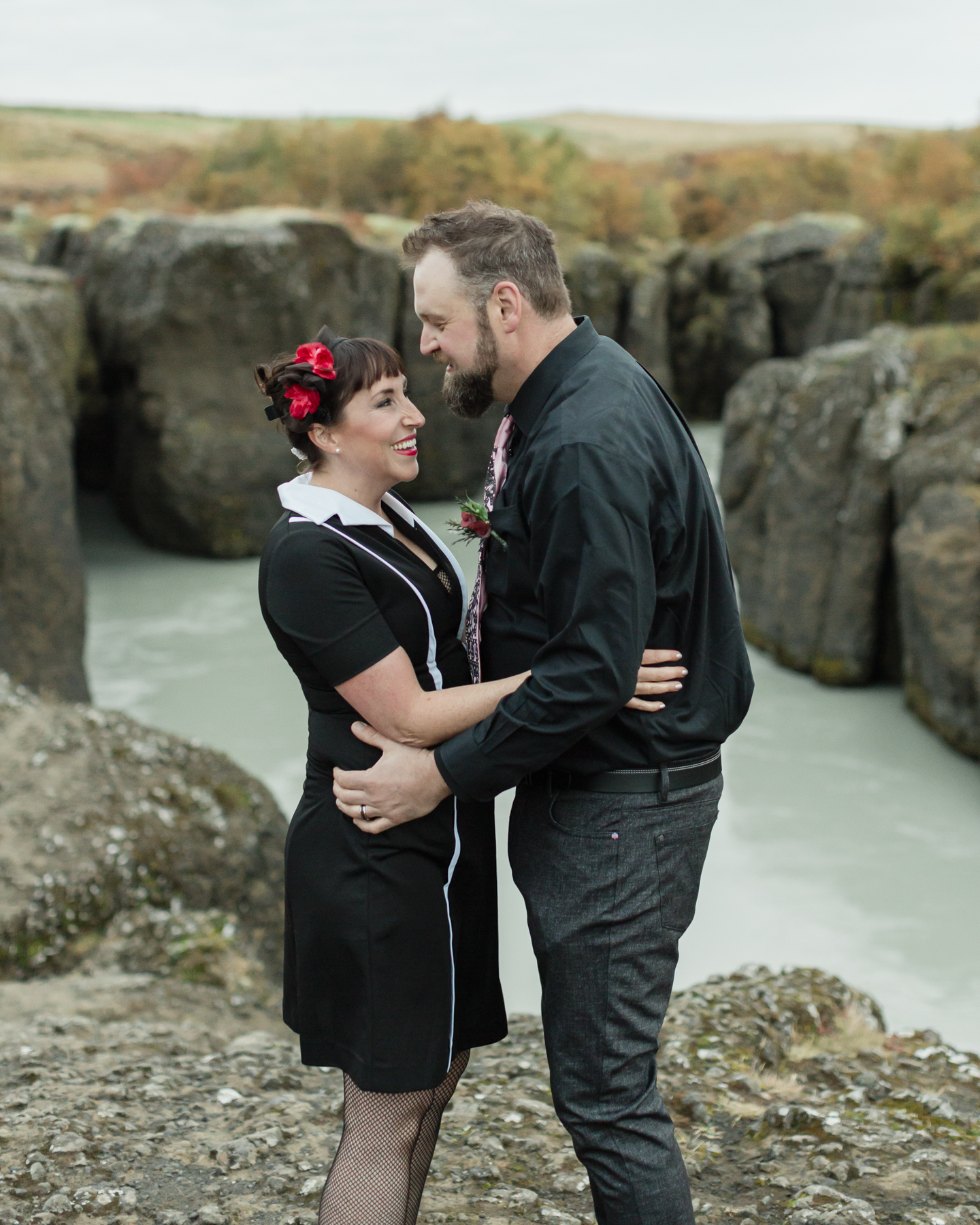 Virginia and Derek kissing in front of a canyon in the Golden Circle