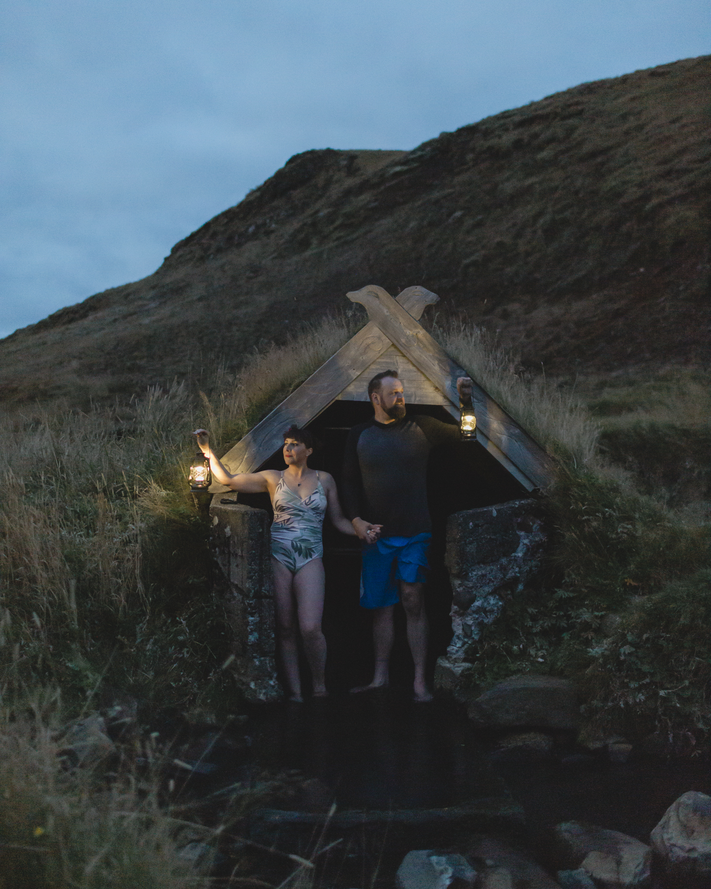 Virginia and Derek holding lanterns at a hot spring in the Golden Circle