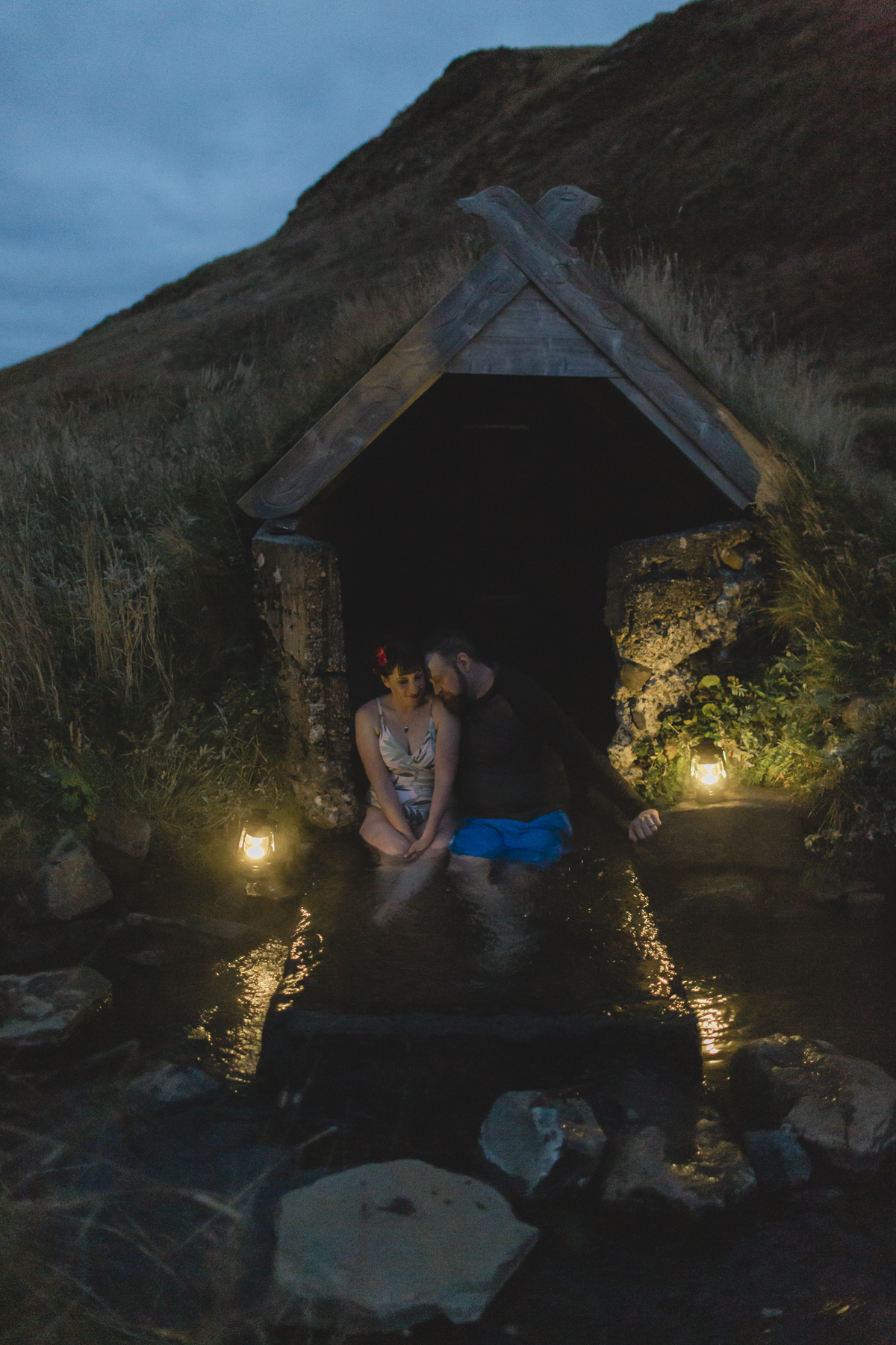 Virginia and Derek cuddling at a hot spring in the Golden Circle