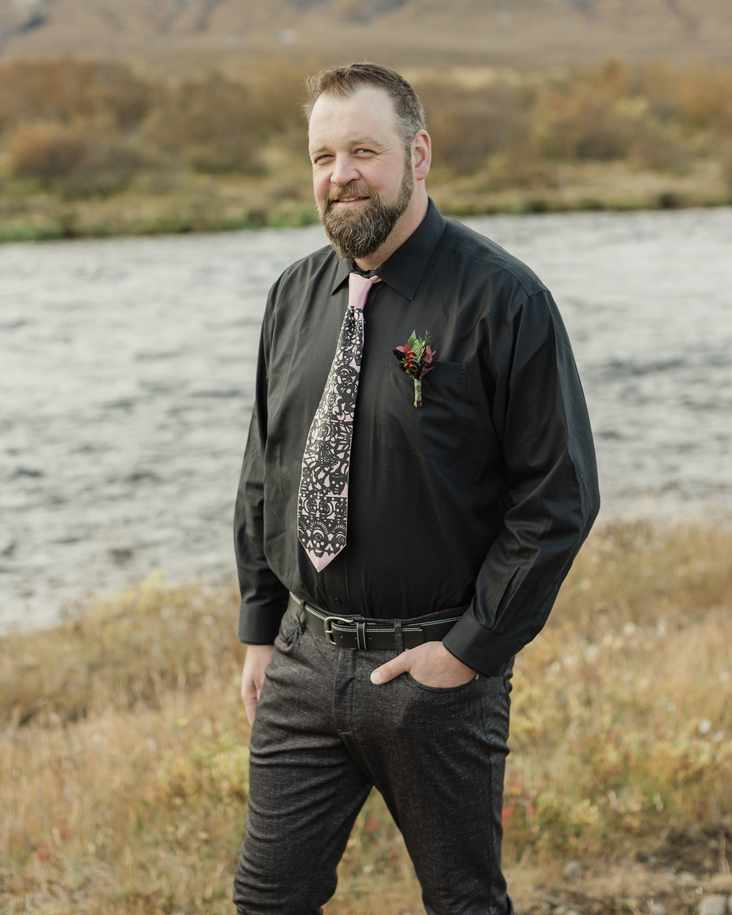 Groom portraits showcasing his accessories for his Iceland elopement 