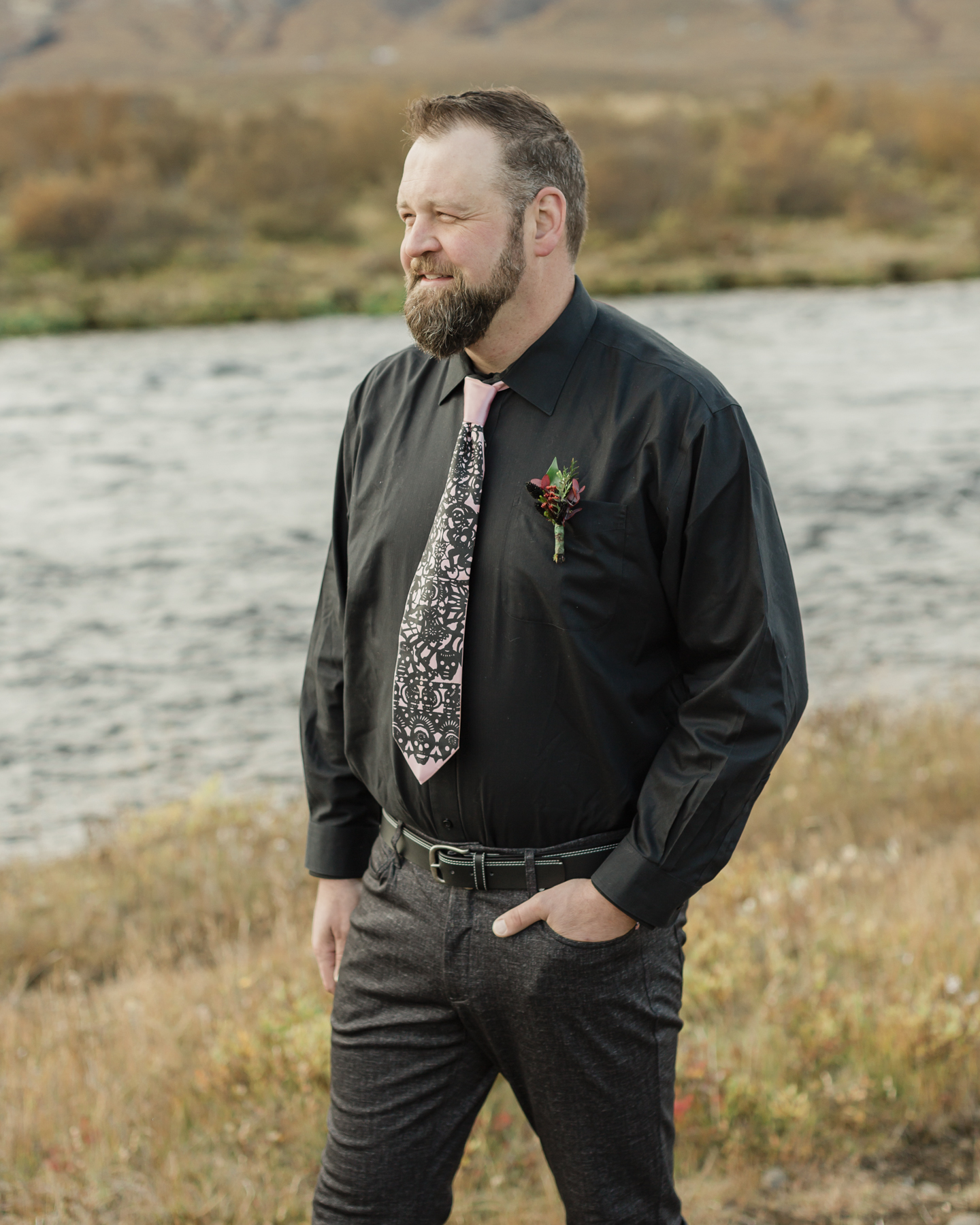 Groom portraits showcasing his accessories for his Iceland elopement 