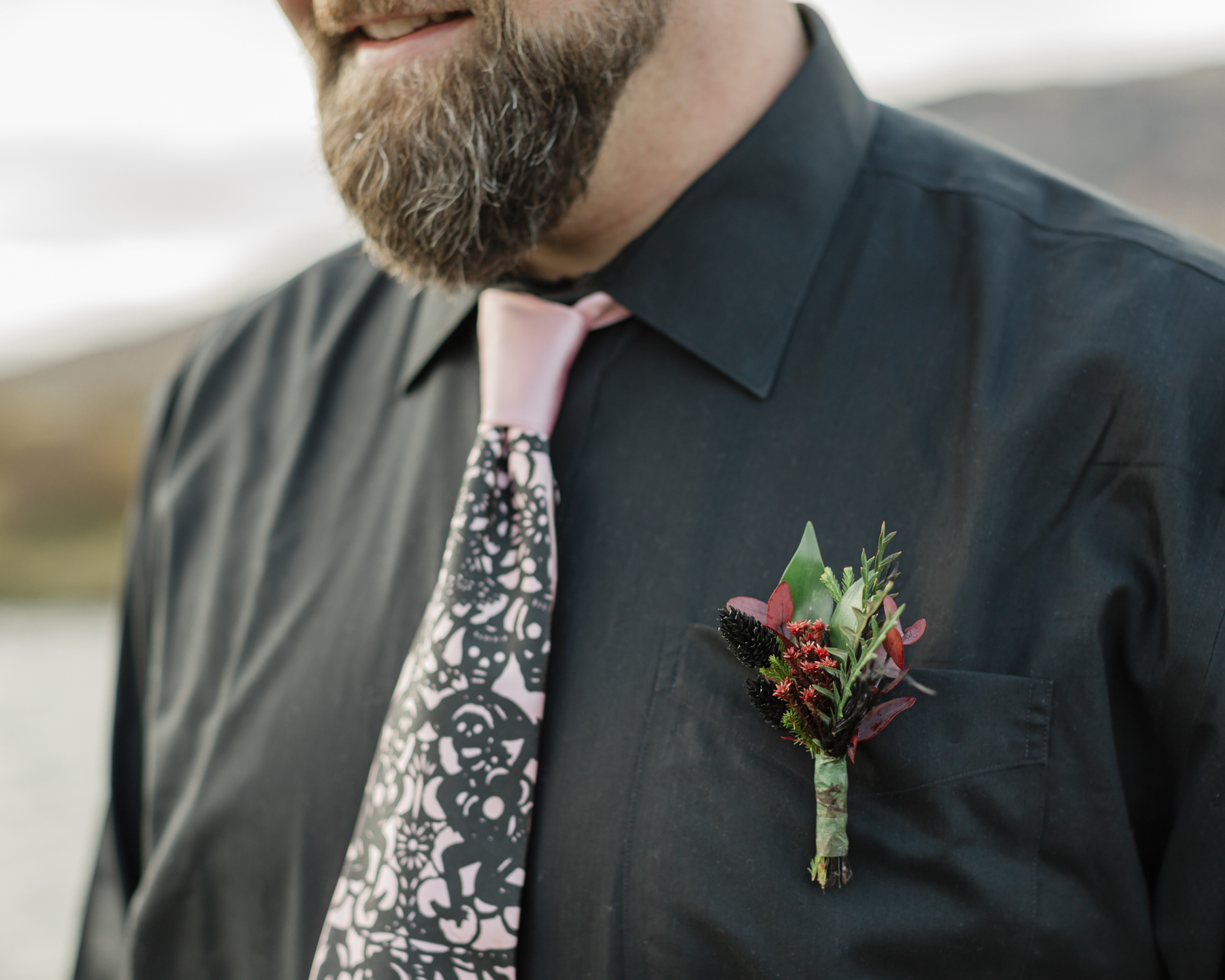 Groom portraits showcasing his accessories for his Iceland elopement 
