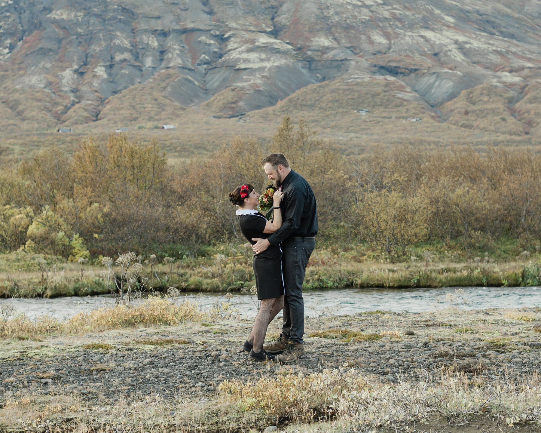 Before their Iceland elopement, Virginia and Derek are having their first look in front of a mountain in the Golden Circle