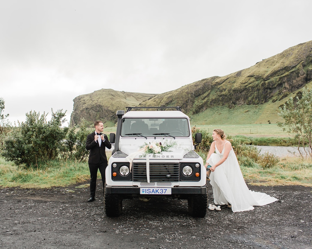 Michael and Nicole get ready near truck for Iceland elopement