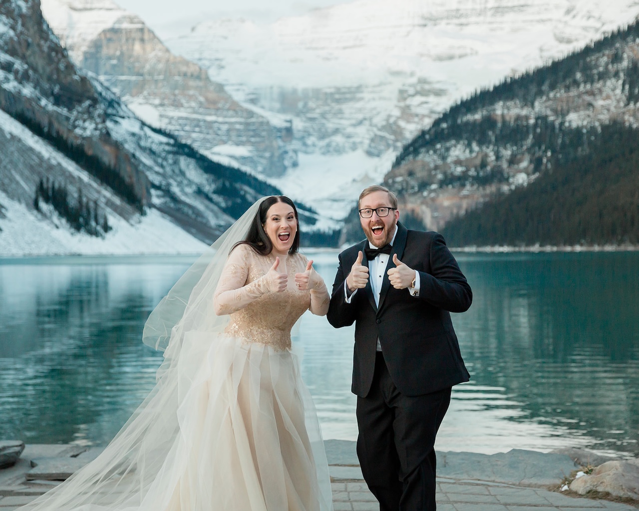 kirby and jonathan elope on lake louise in winter