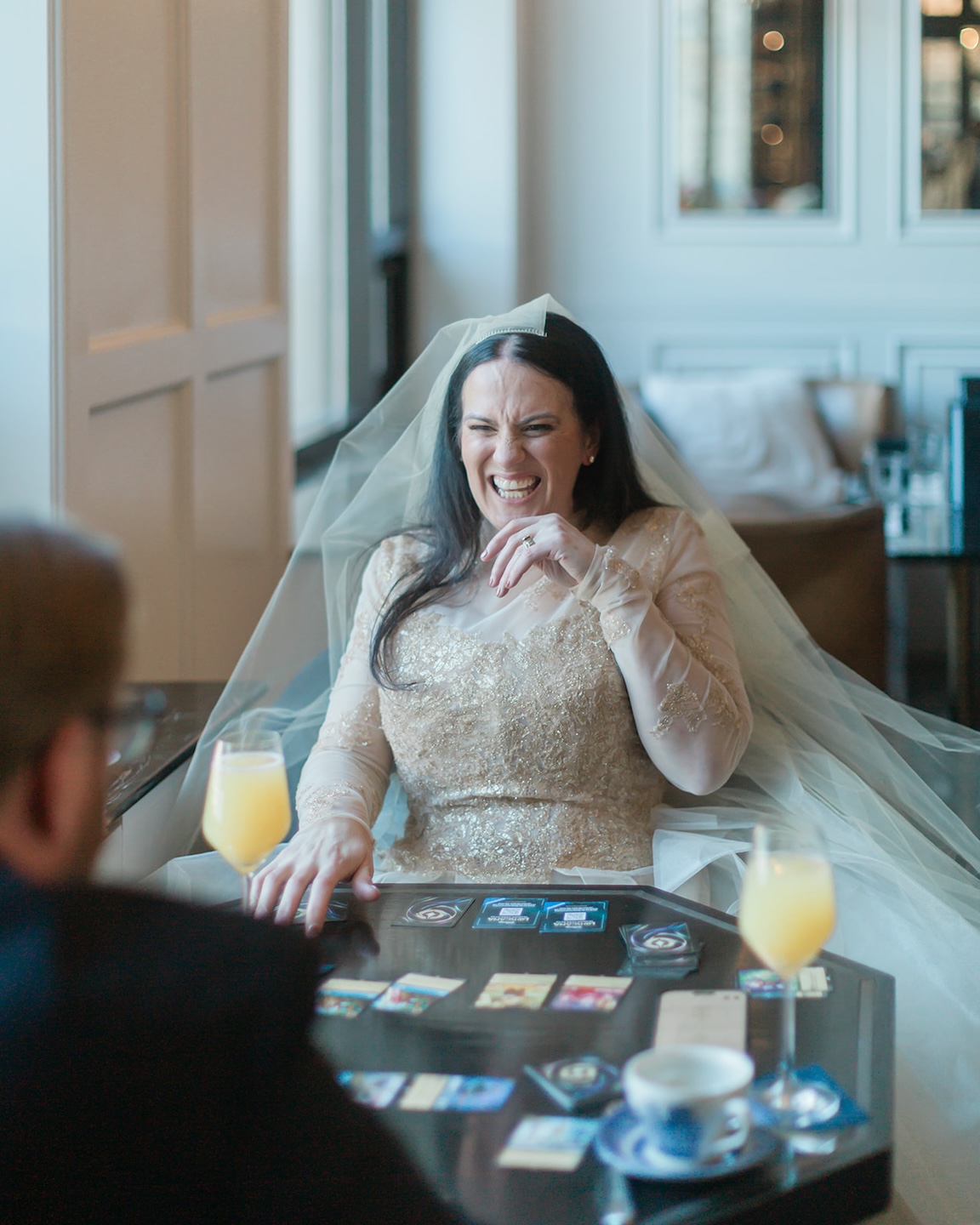 Kirby and Jonathan play a game of cards after their elopement