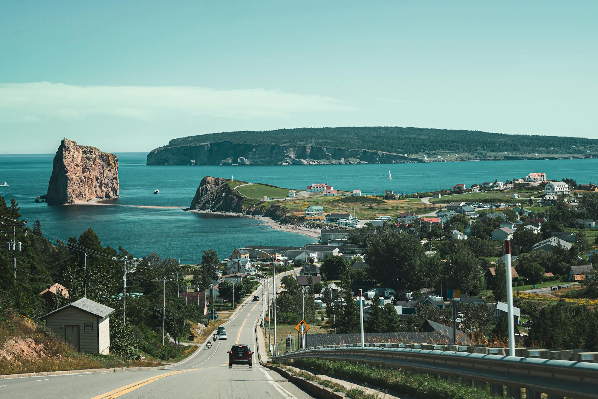 Gaspe peninsula captured from the incoming road with a view of the ocean, village and perce rock