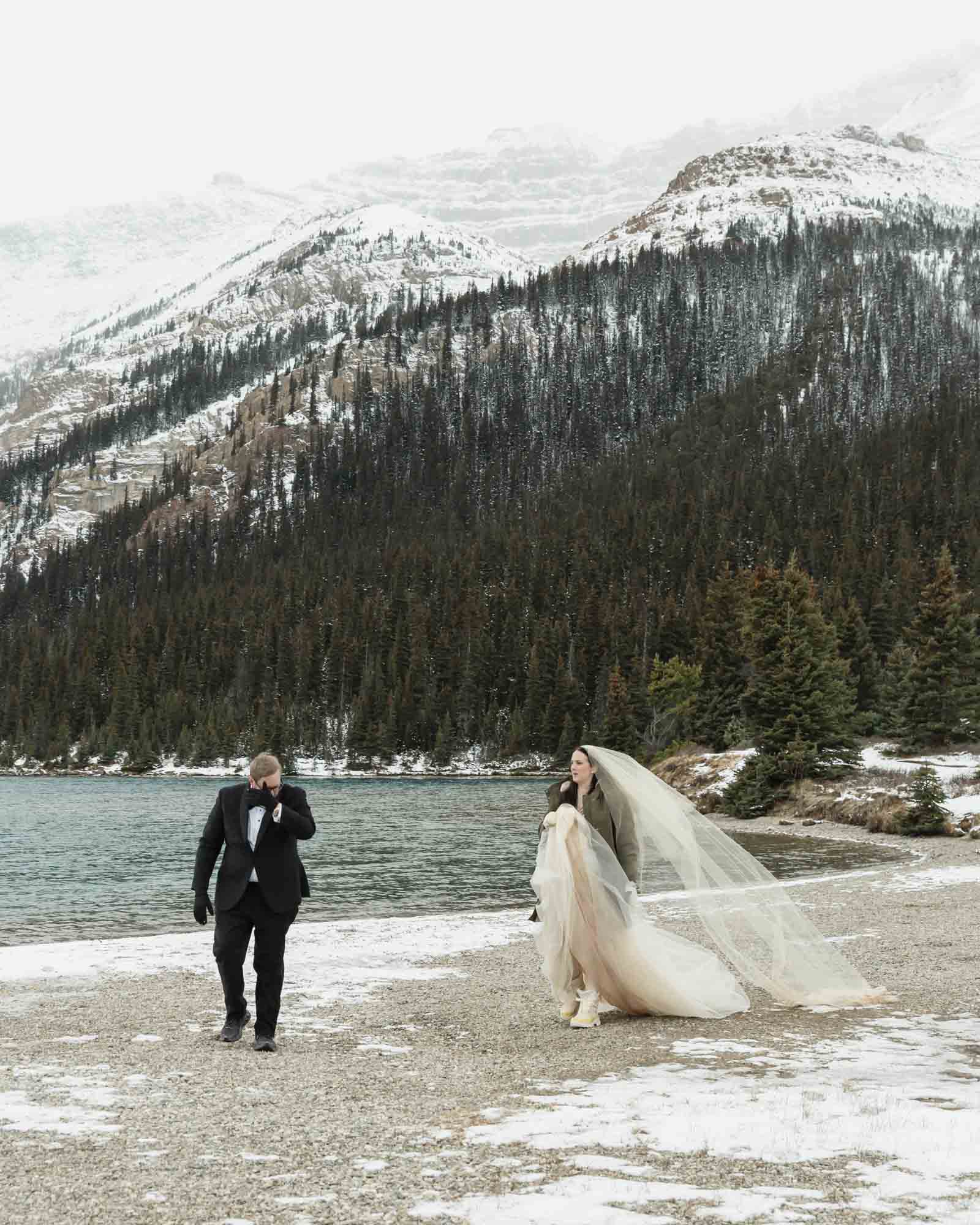Wedding couple adventuring at Bow Lake in Banff National Park