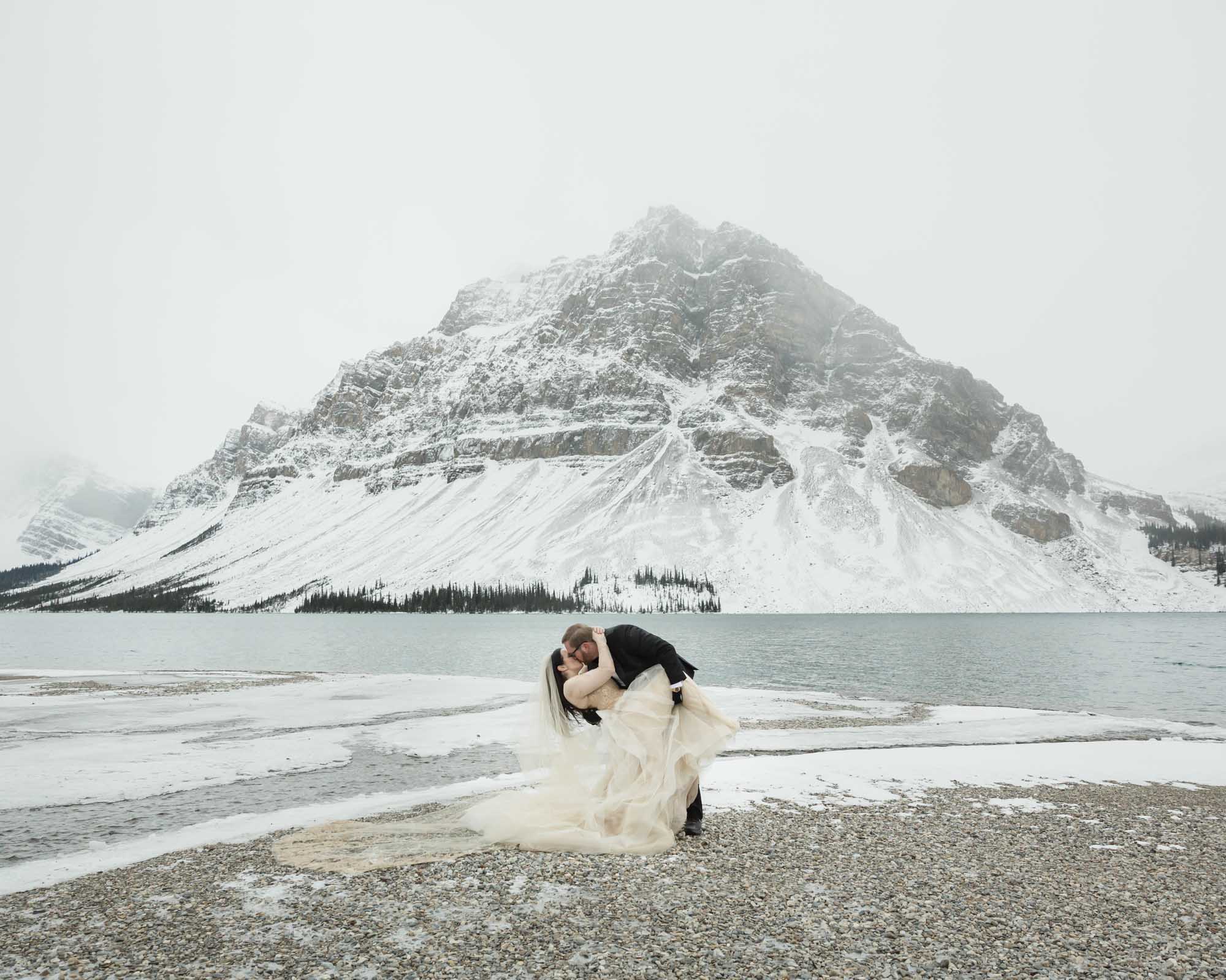 Wedding couple posing at Bow Lake in Banff National Park during their Elopement