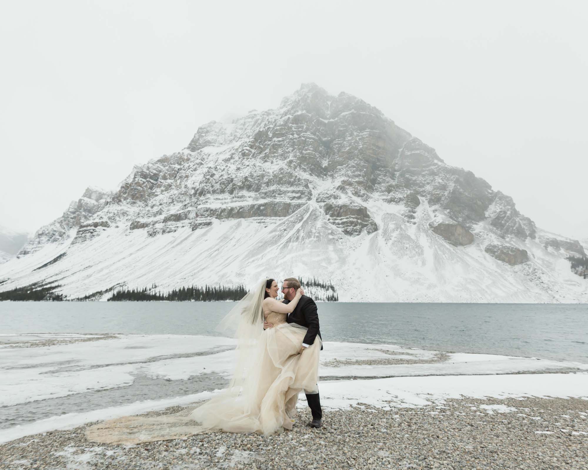 Wedding couple posing at Bow Lake in Banff National Park during their Elopement