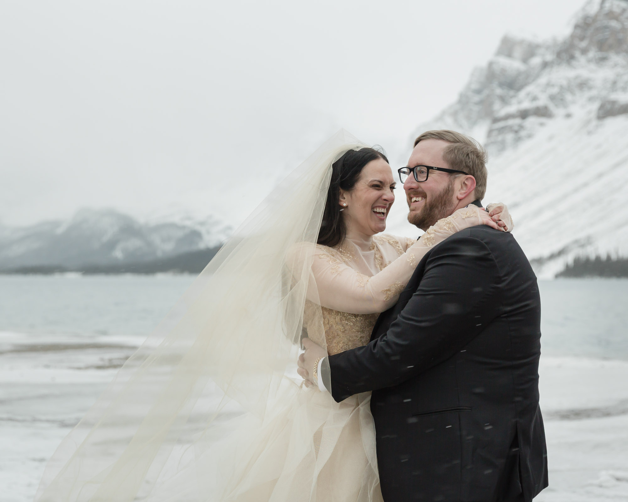 Wedding couple posing at Bow Lake in Banff National Park during their Elopement